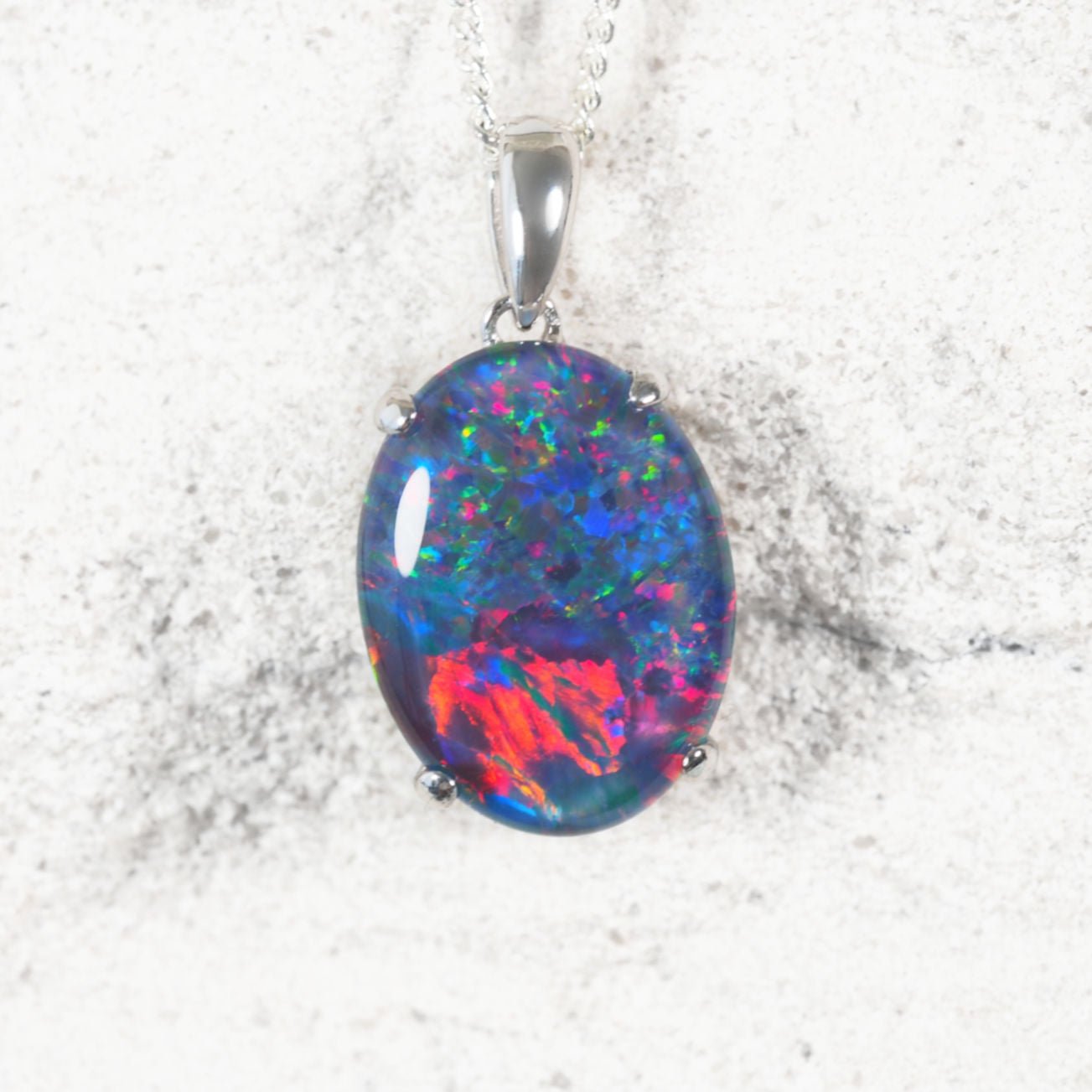 ‘Classic Queen’ sterling silver opal pendant with claw-set oval Australian triplet opal in vivid multi-coloured tones