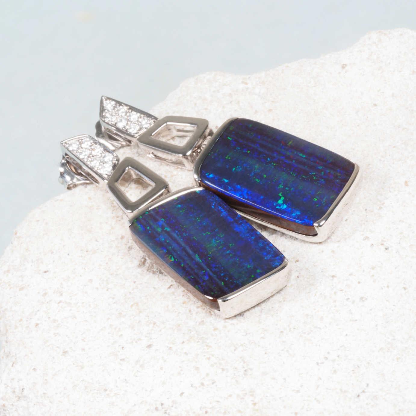 boulder opal earrings set inn 18 carat white gold