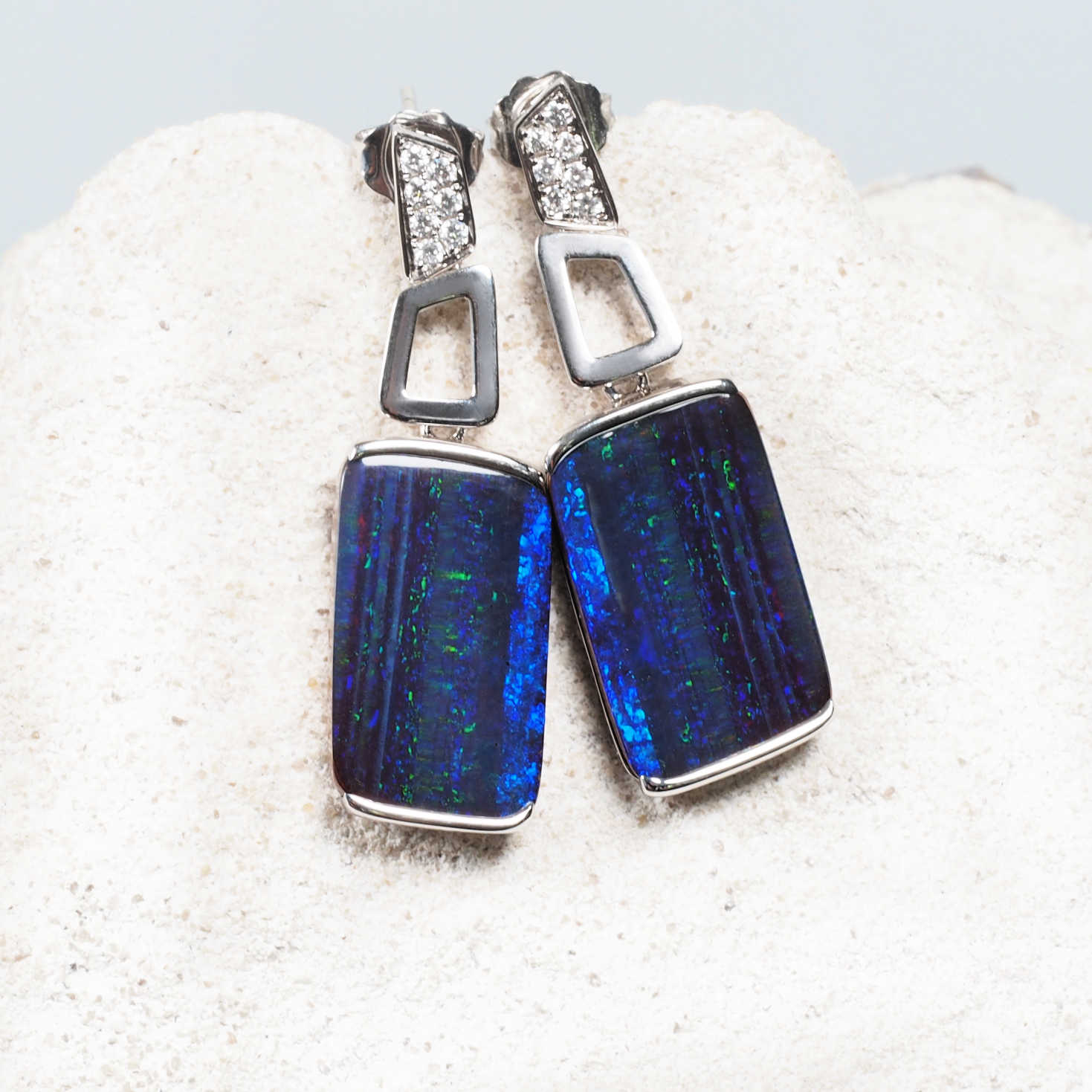 blue opal earrings set in white gold with diamonds