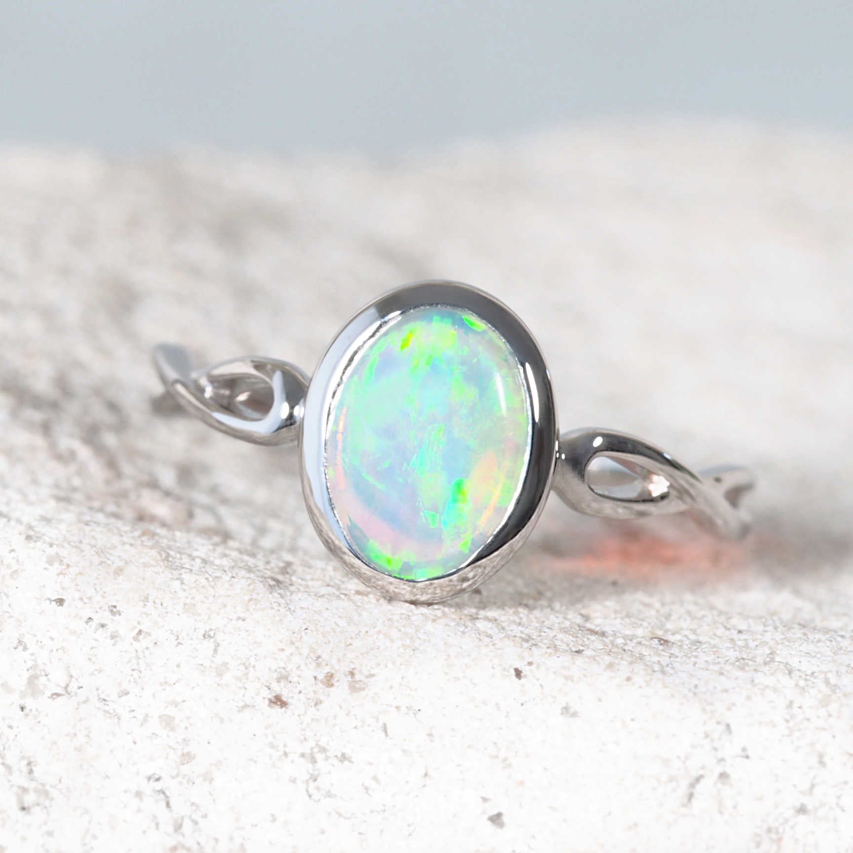 Cliona crystal opal ring with green and blue hues in white gold