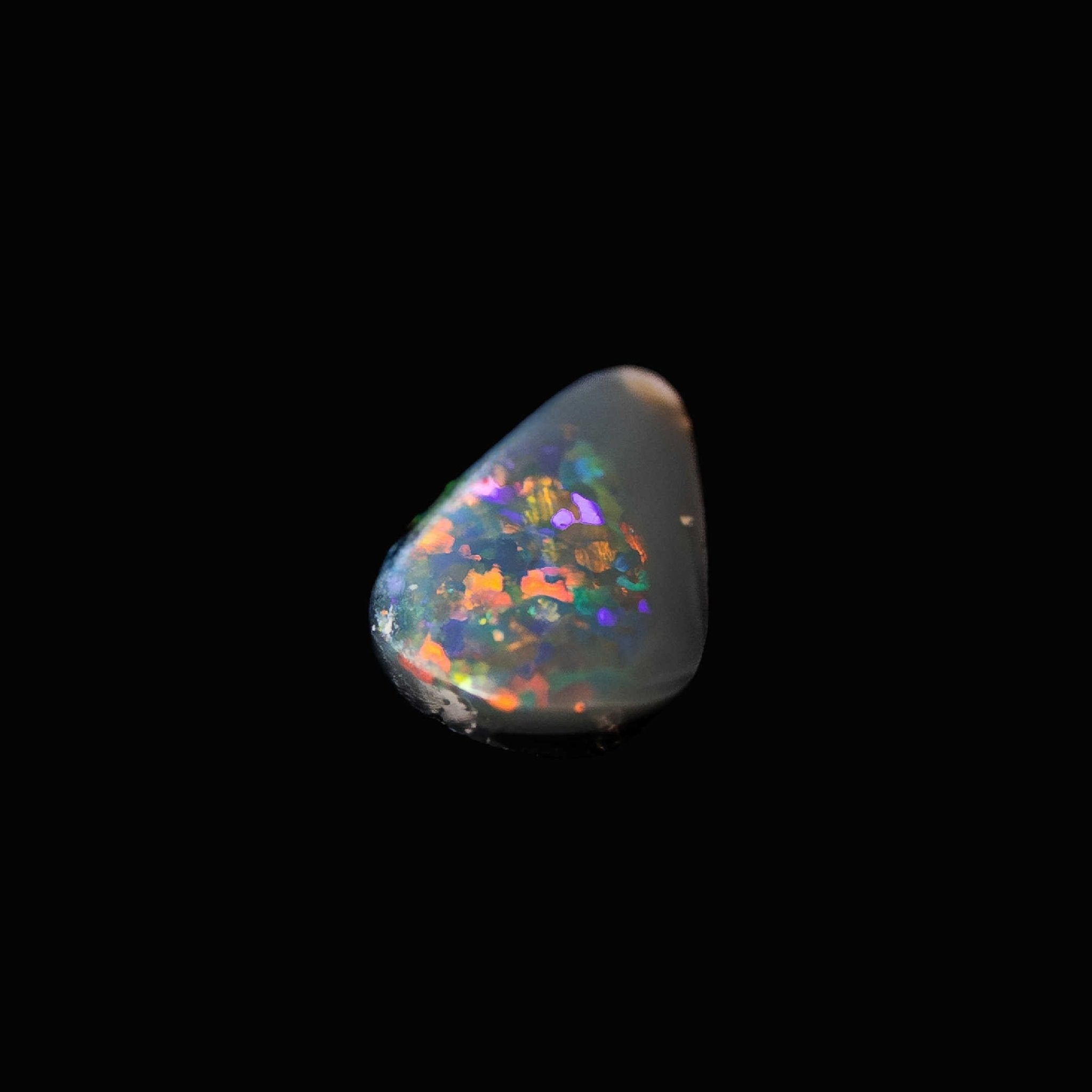'Colourfire' teardrop-shaped solid semi-black opal from Lightning Ridge