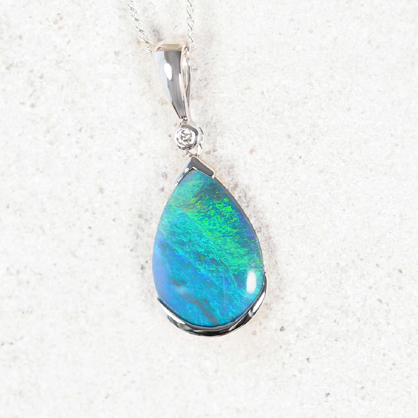 Dania black opal necklace pendant in 14ct white gold with teardrop Lightning Ridge opal and diamond accent