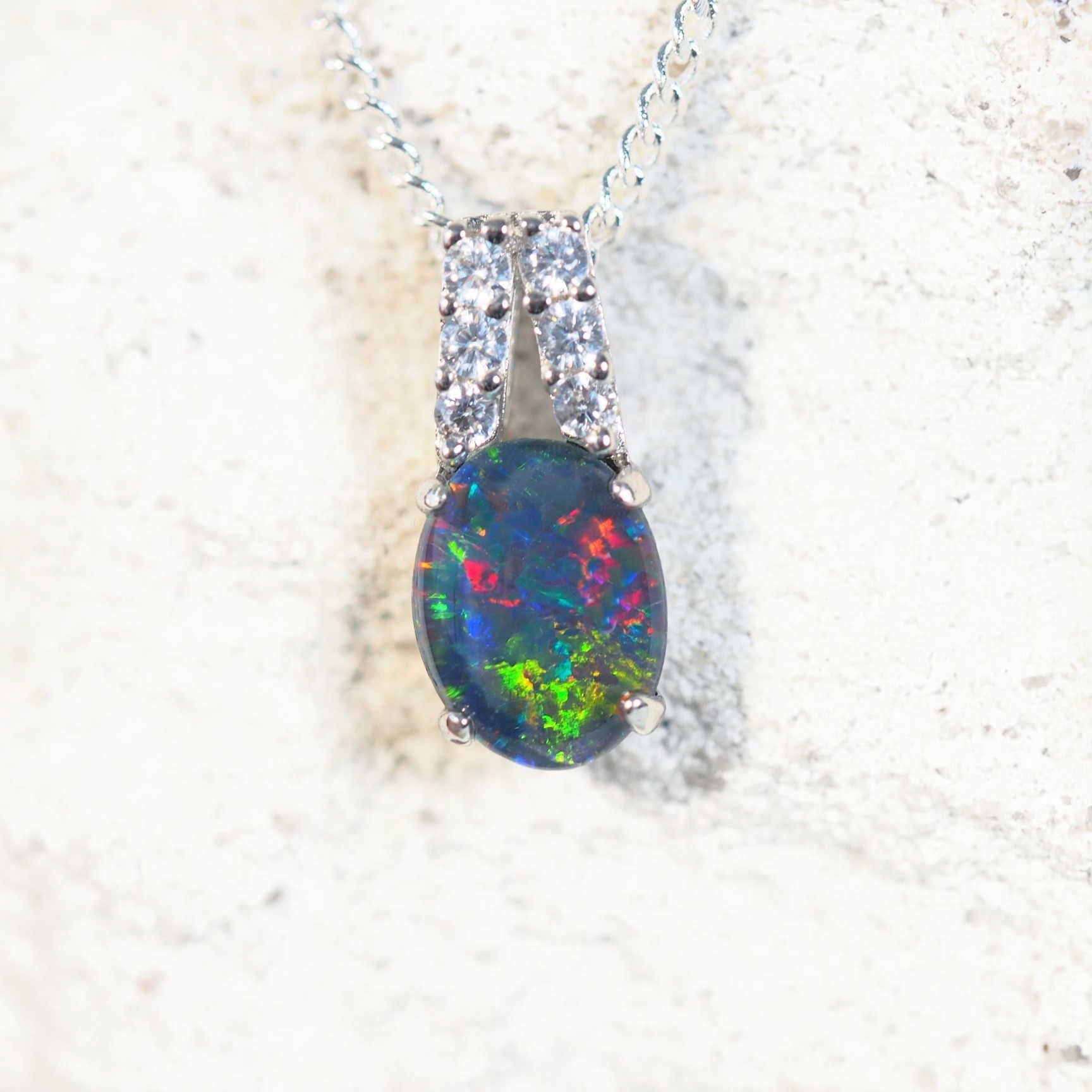 close up of danike silver opal pendant