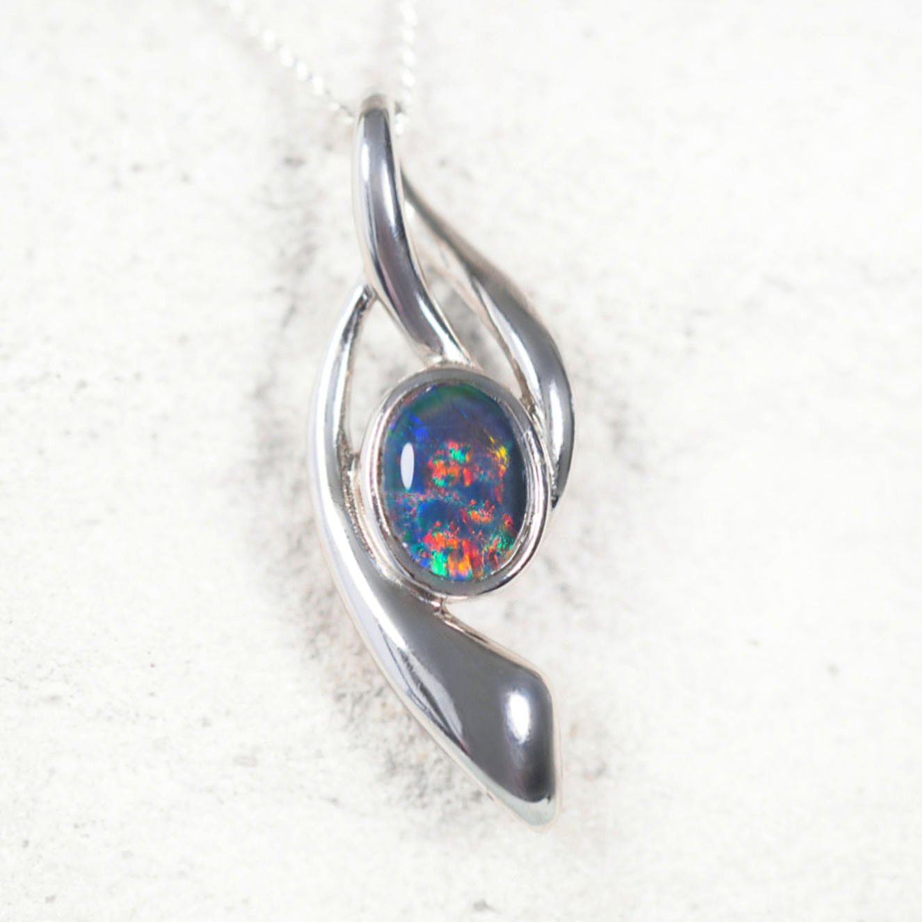 Deena’ sterling silver opal pendant with claw-set oval Australian triplet opal in vibrant multi-colour tones