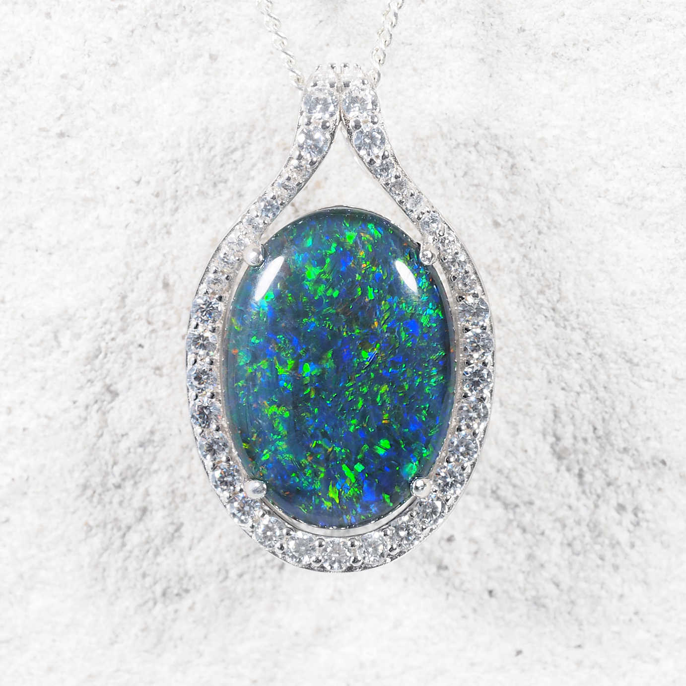 ‘Dianna’ sterling silver opal pendant with multi-coloured oval Australian triplet opal and a halo of forty sparkling diamantés