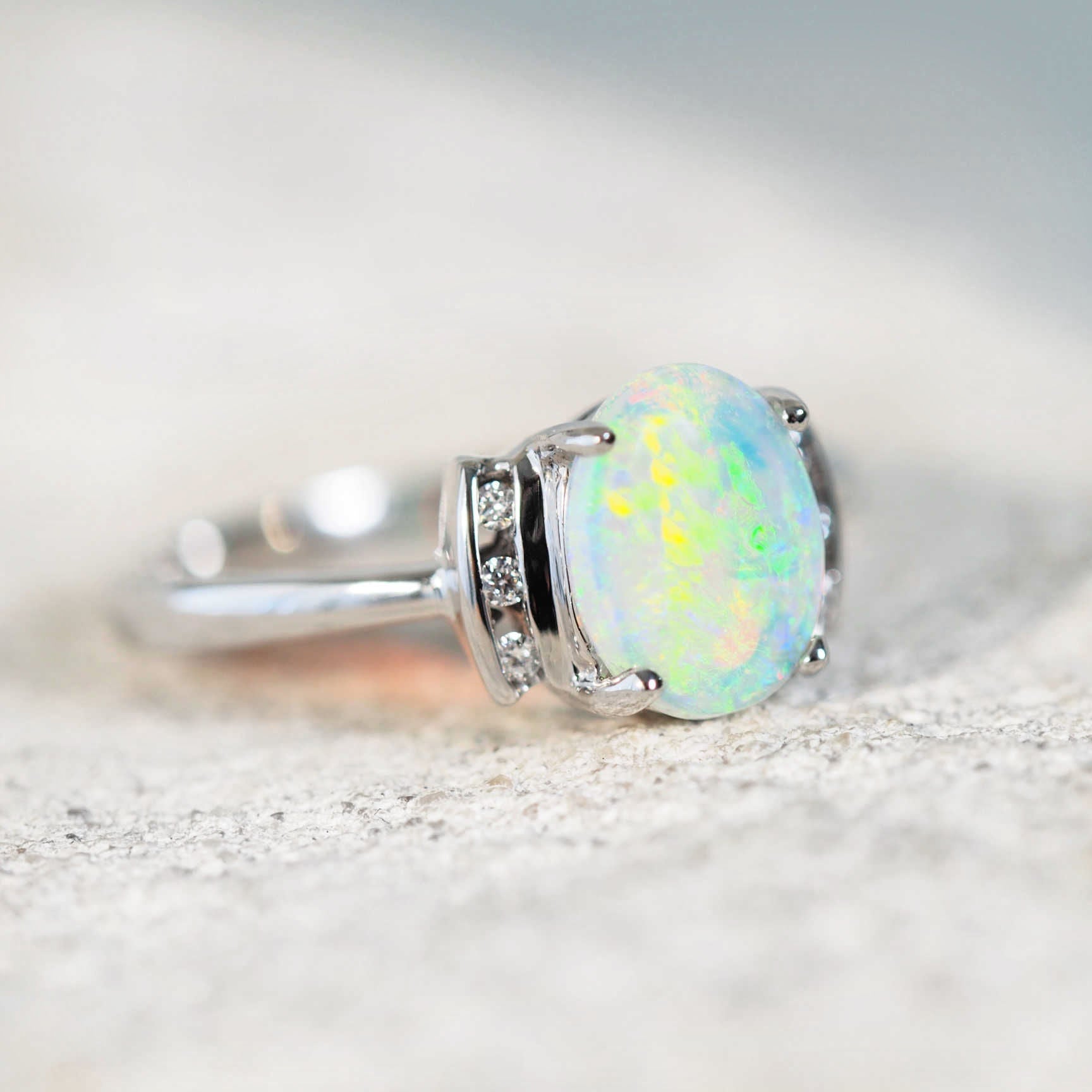 gold opal ring set with a crystal opal