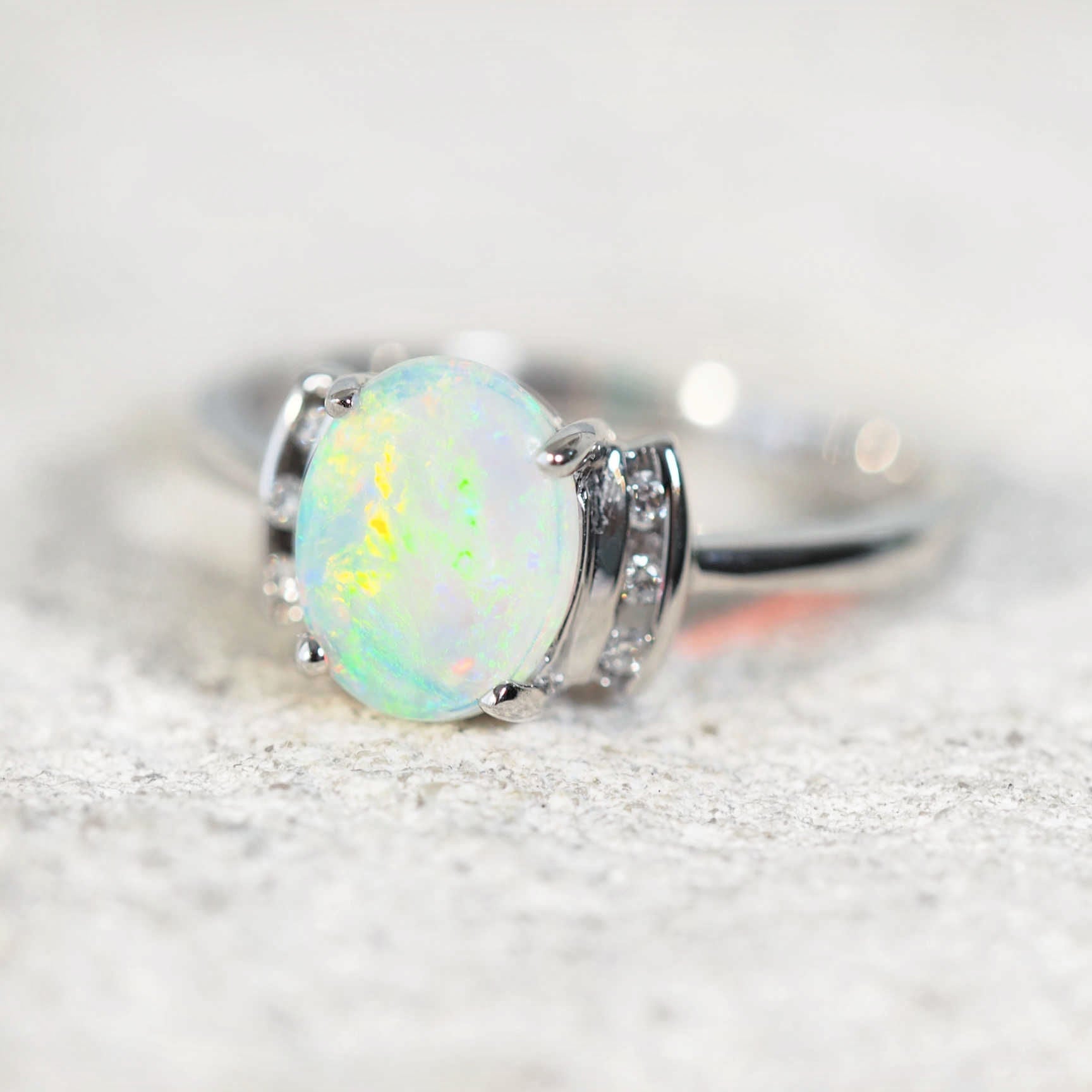 opal ring set into a white gold setting with diamonds