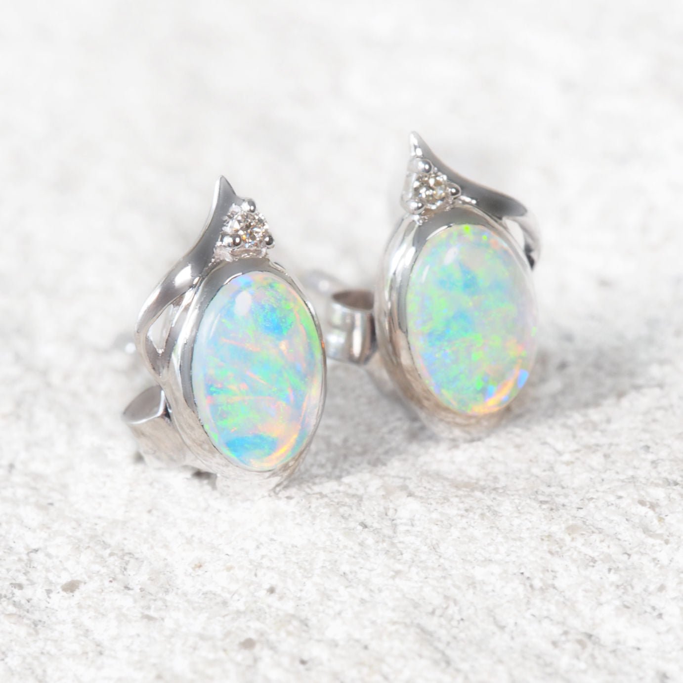 white gold australian opal earrings set in white gold with diamonds
