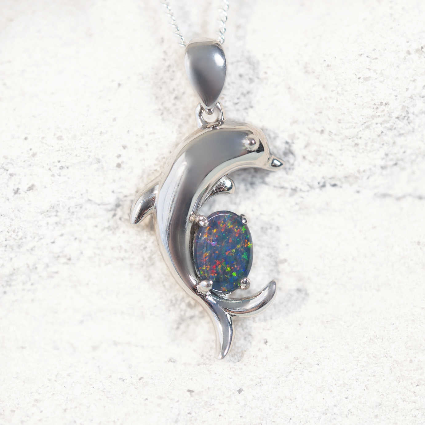 'Dolphin' opal pendant in sterling silver slide design with claw-set oval Australian triplet opal in vibrant multi-coloured tones