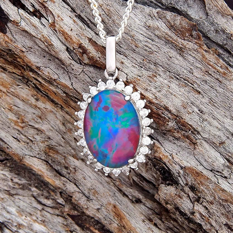 Dazzling sterling silver diamante ring design necklace pendant claw set with a colourful oval Australian triplet opal and twenty six cubic zirconia.