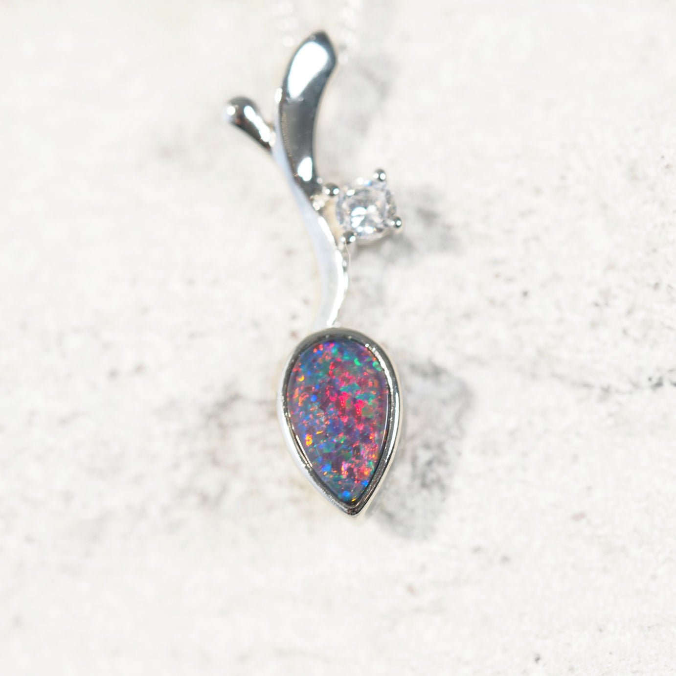 Sterling silver decorative necklace pendant featuring teardrop-shaped Australian triplet opal with vibrant play-of-colour