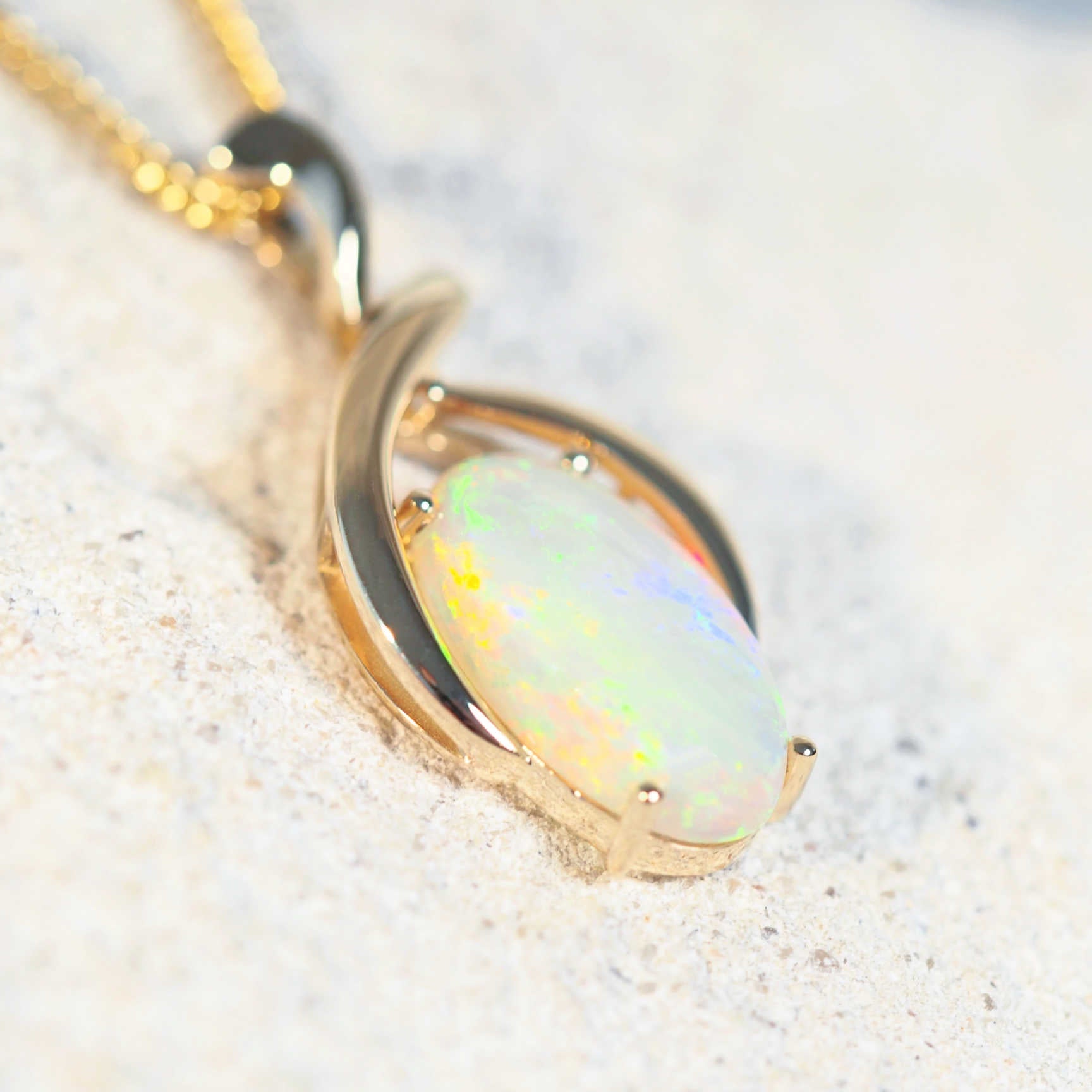 gold opal pendant with a solid opal