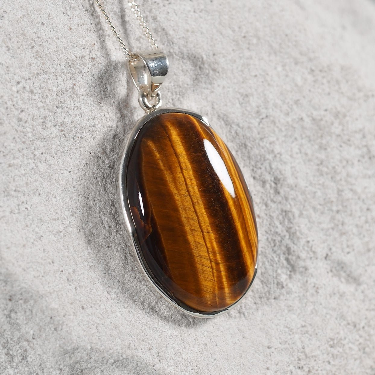 'Elise' sterling silver pendant featuring a warm brown Tiger’s Eye gemstone.