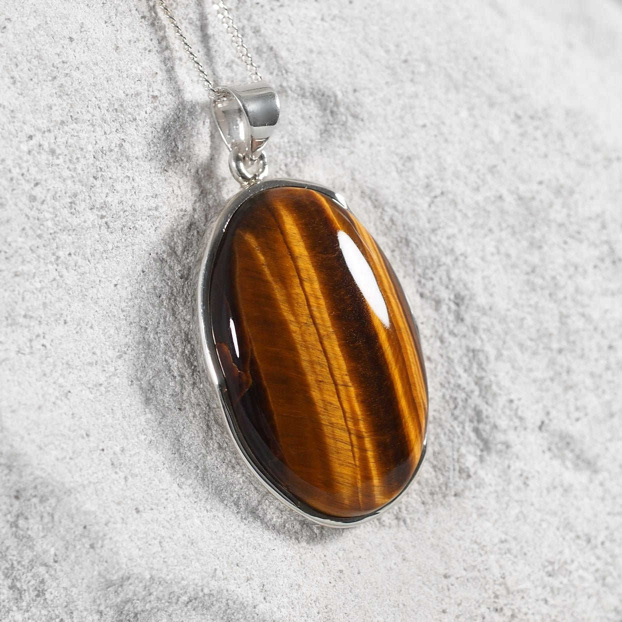 'Elise' sterling silver pendant featuring a warm brown Tiger’s Eye gemstone.