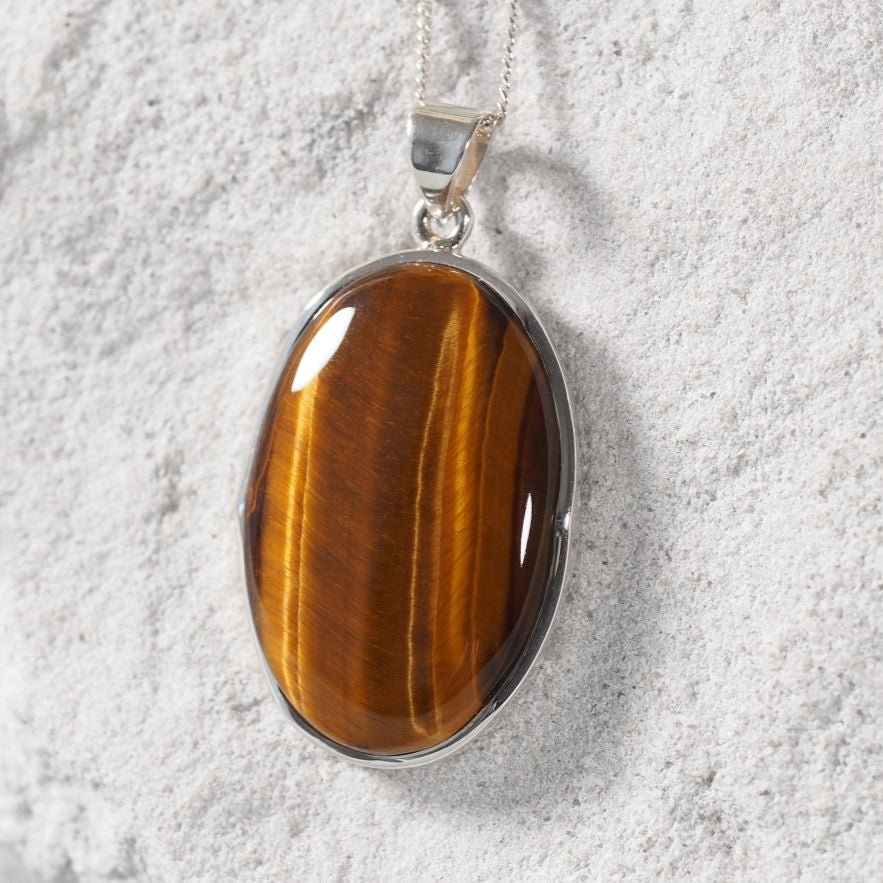 Tiger eye pendant showcasing warm brown and light hues