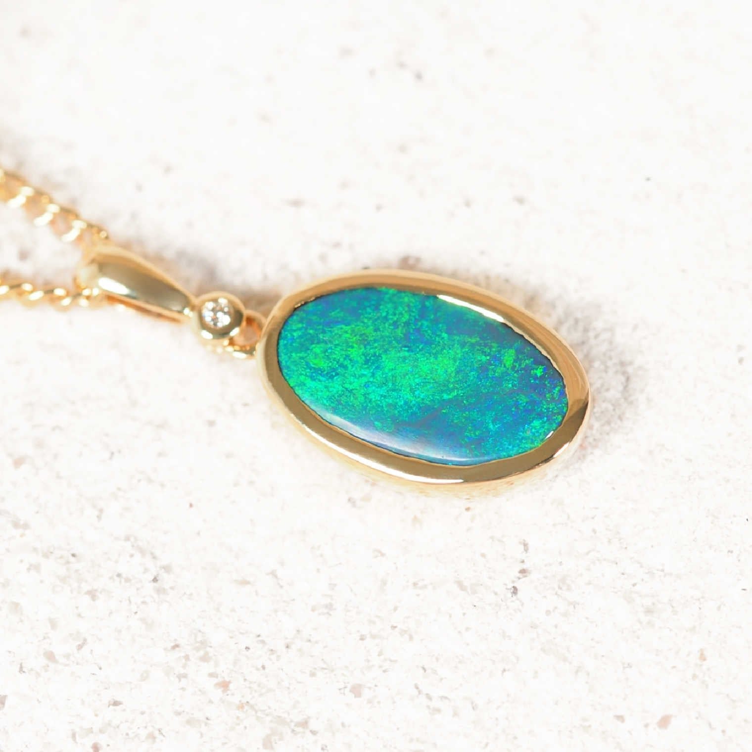 Australian black opal pendant with radiant emerald-green play-of-colour