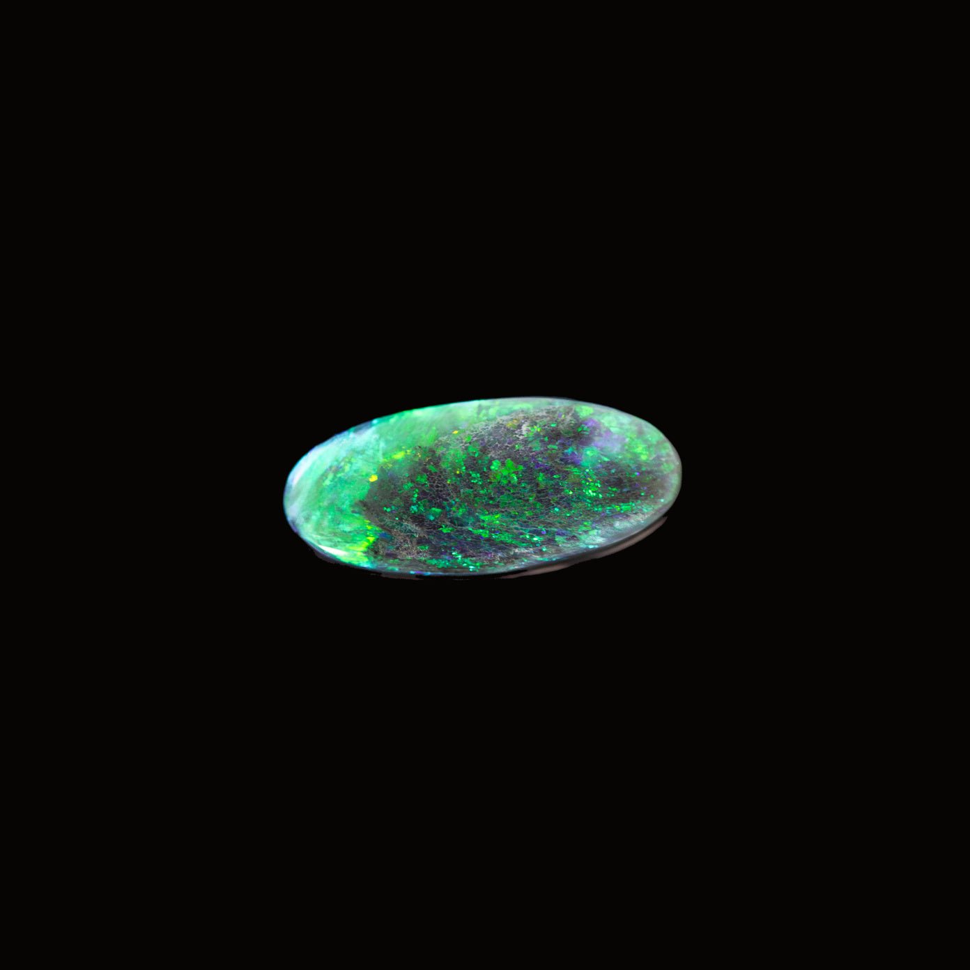 'Emerelle' Lightning Ridge black opal gemstone with vivid green fire on dark charcoal body tone