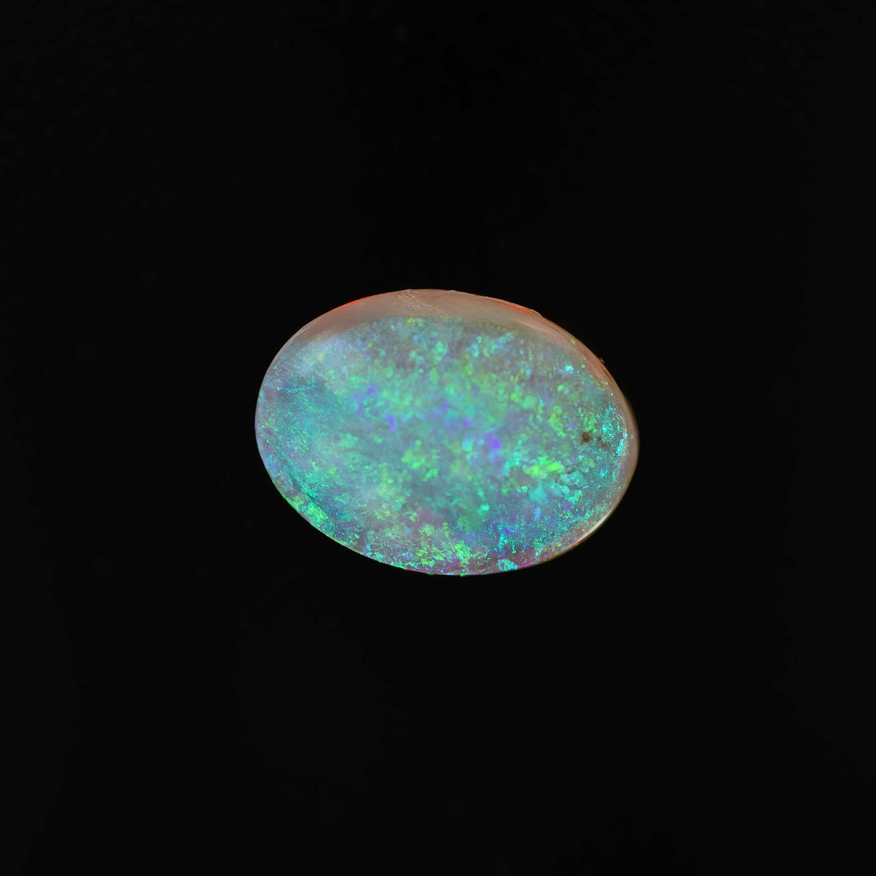 Solid crystal opal from Australia with vivid green speckle pattern