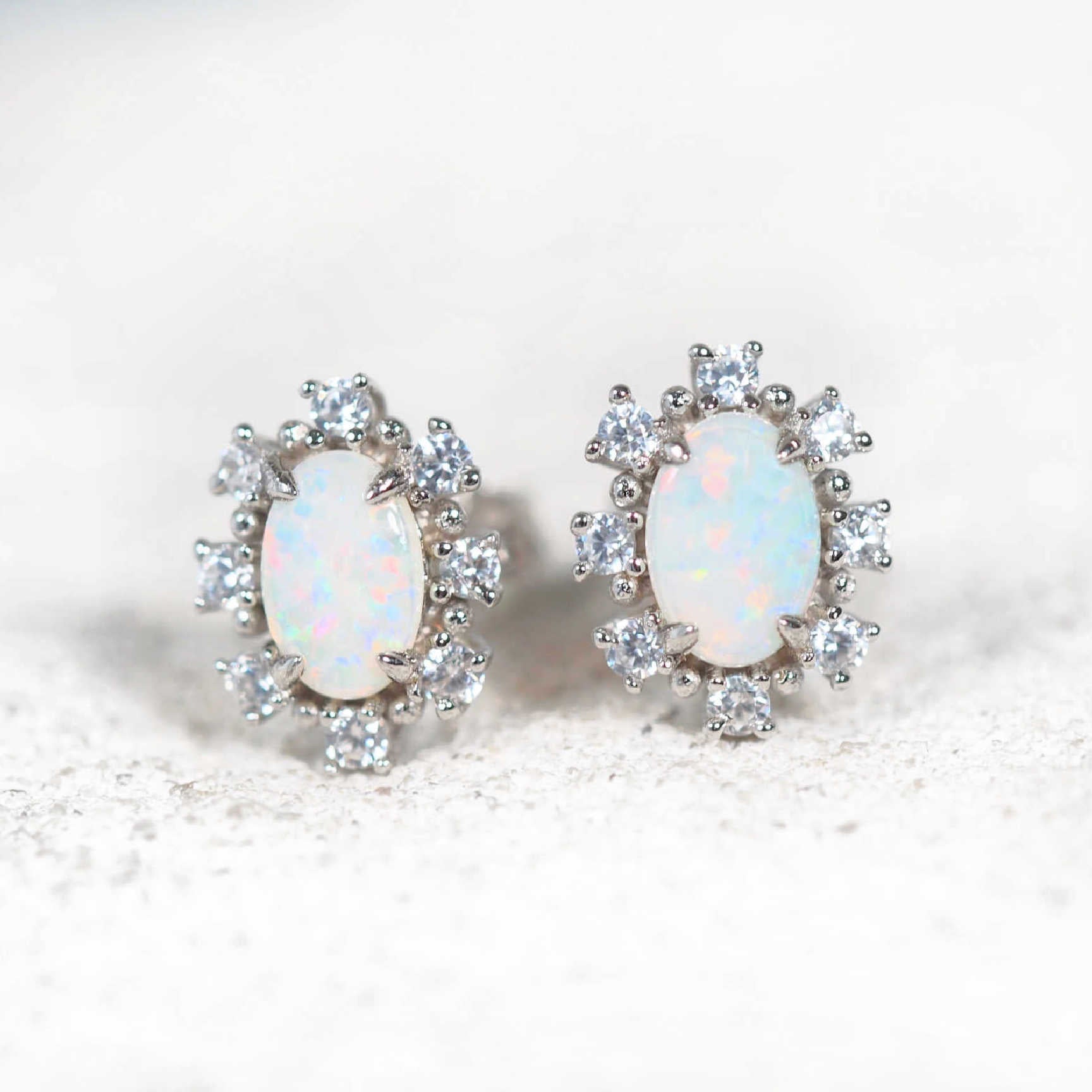 Empress sterling silver stud opal earrings with multi-coloured South Australian solid crystal opals and eight sparkling cubic zirconias per earring.