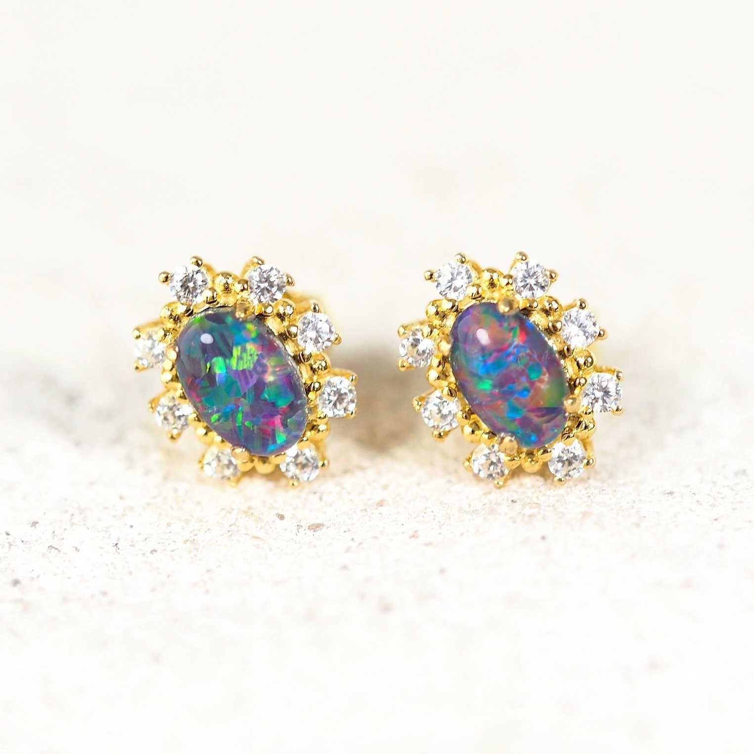 'Empress' gold-plated silver opal earrings featuring vibrant Australian triplet opals with a halo of eight sparkling diamantés, perfect for elegant occasions.
