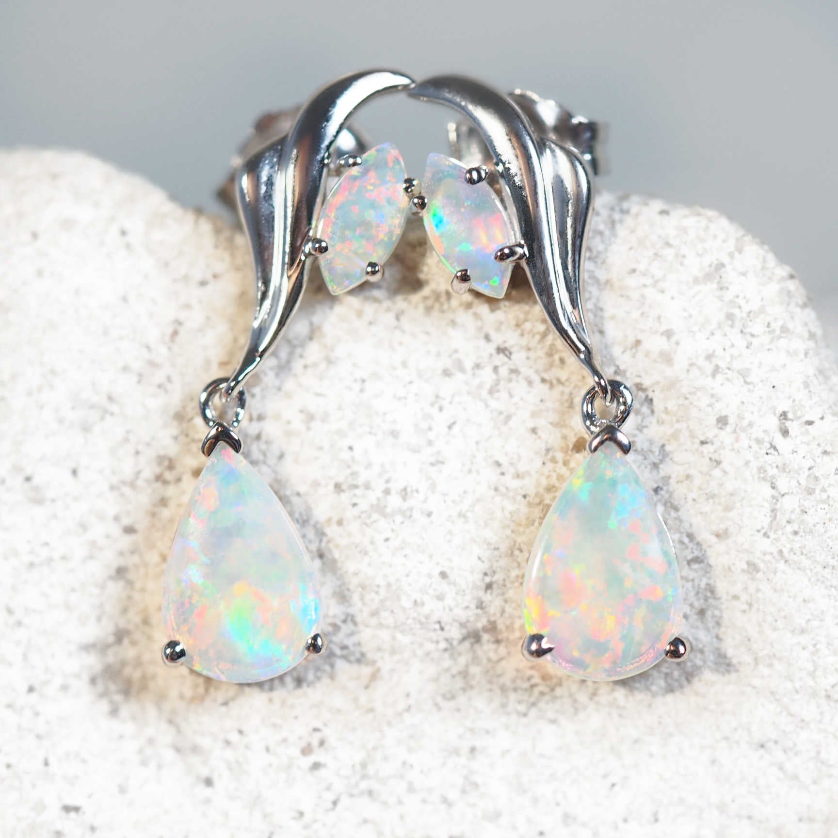 white opal gold earrings featuring natural south australian solid opals