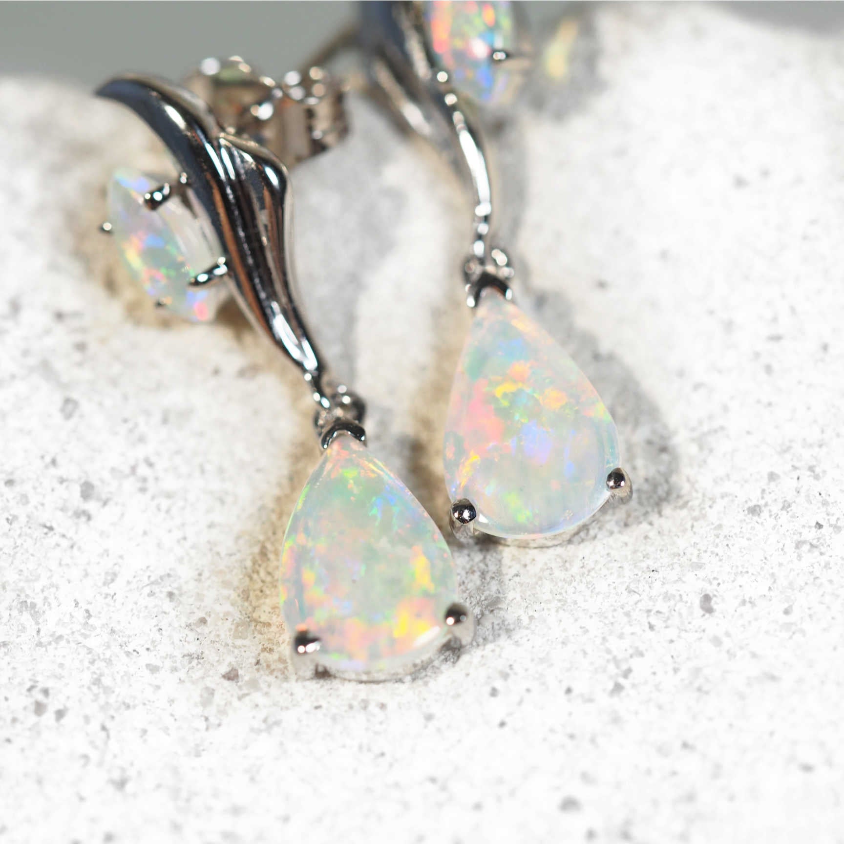 colourful drop opal earrings set in white gold