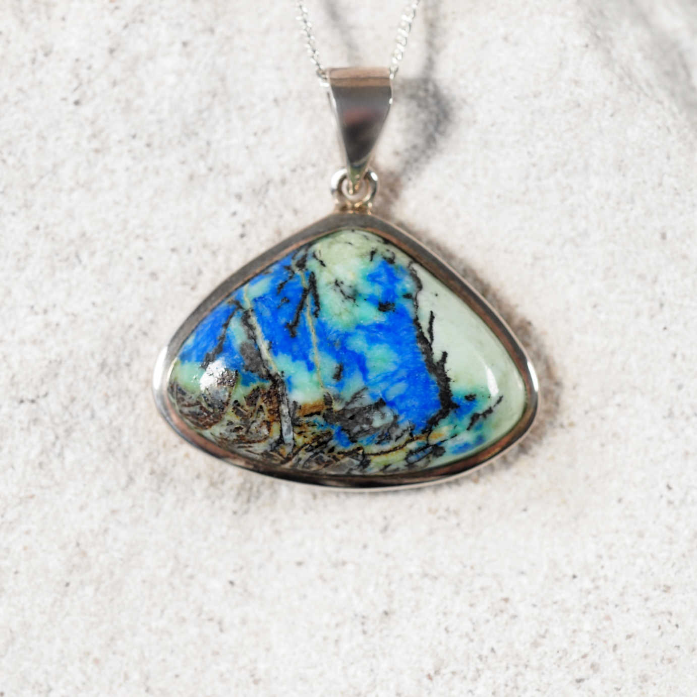 'Faye' pendant with triangular Azurite/Chrysocolla stone set in silver, showing rich blue and green tones