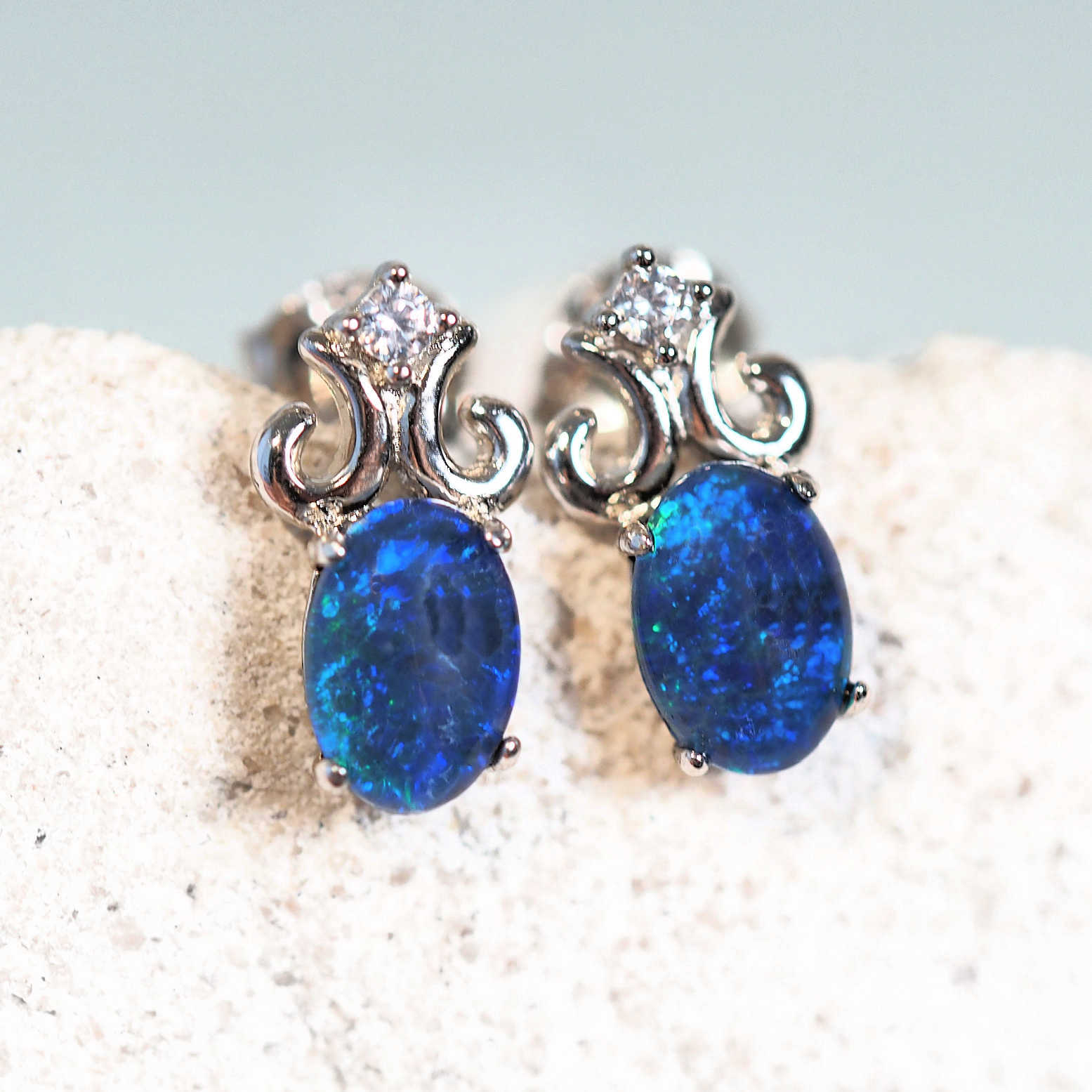 blue opal earrings set in sterling silver