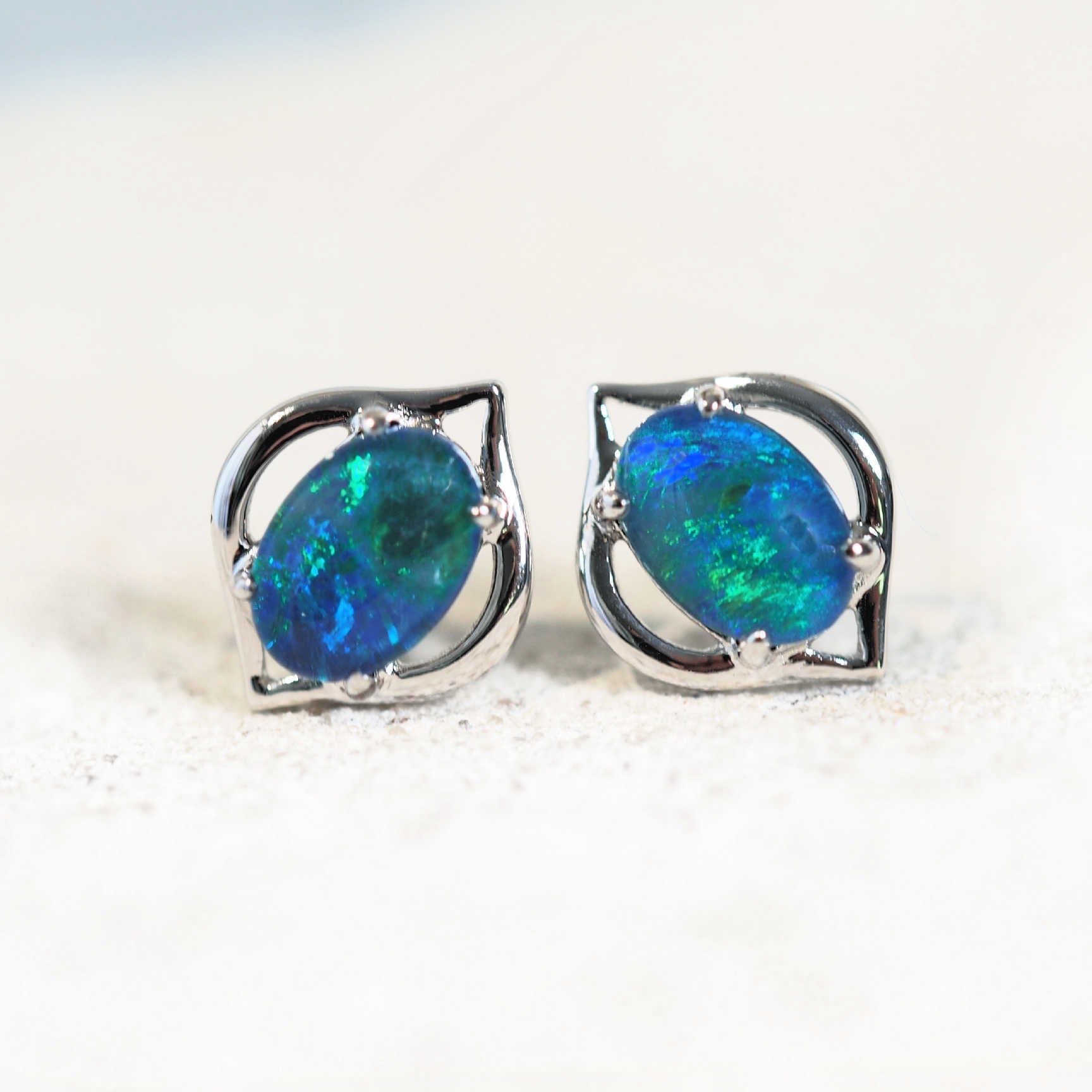 stud opal earrings set with blue Australian opals in silver