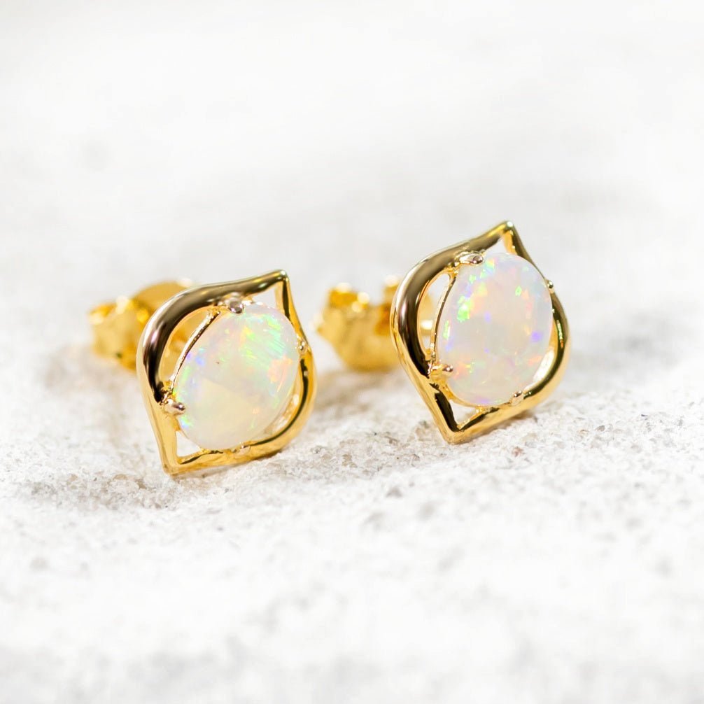 opal earrings set in gold plated silver with a genie design