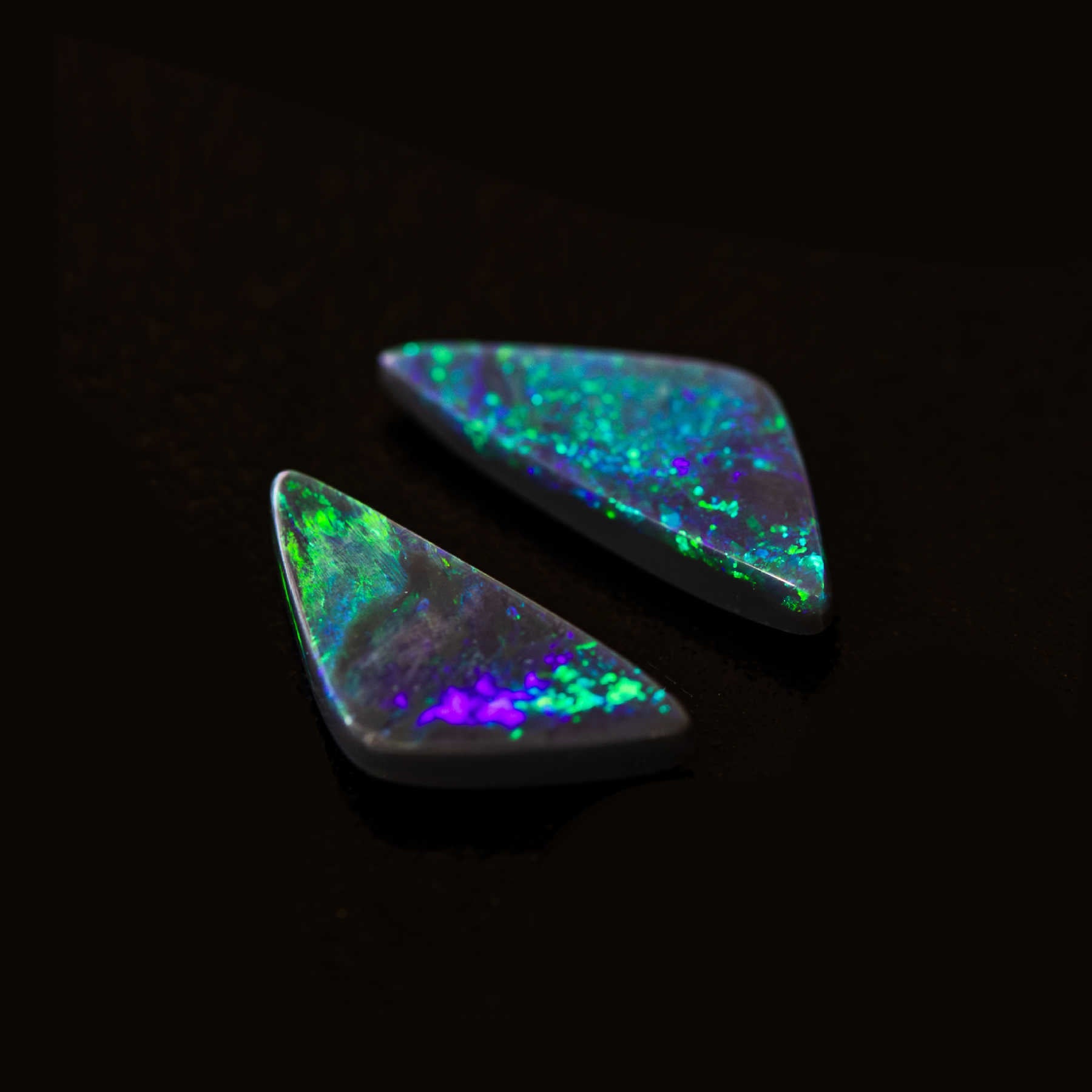 Shimmering Green Aurora opals with bright green and blue flashes