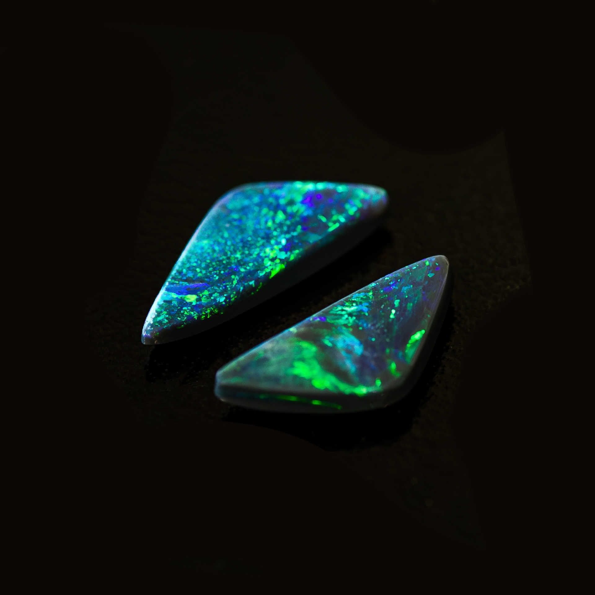 Pair of Green Aurora triangular black opals from Lightning Ridge, Australia