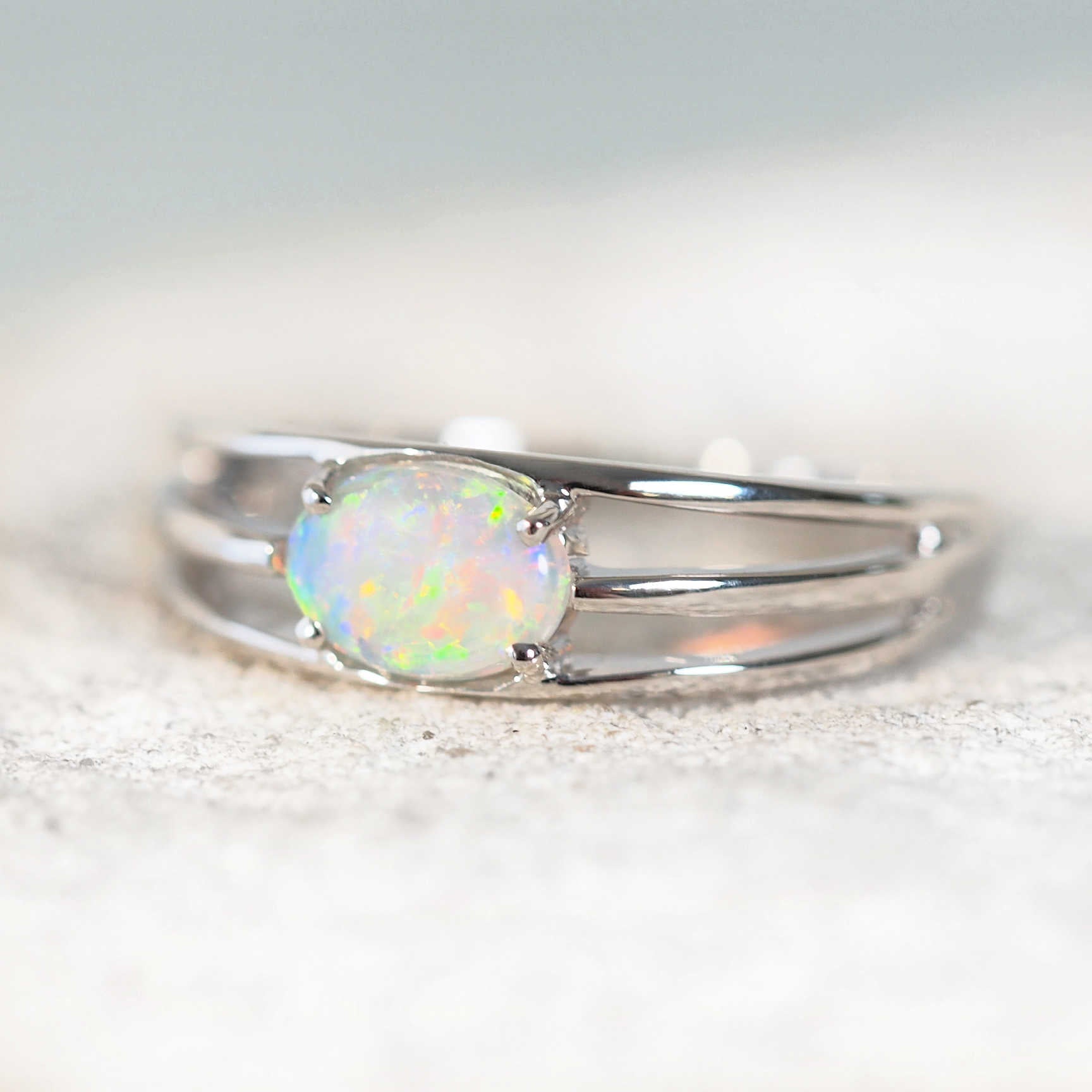 side set crystal opal ring in luxury 14ct white gold