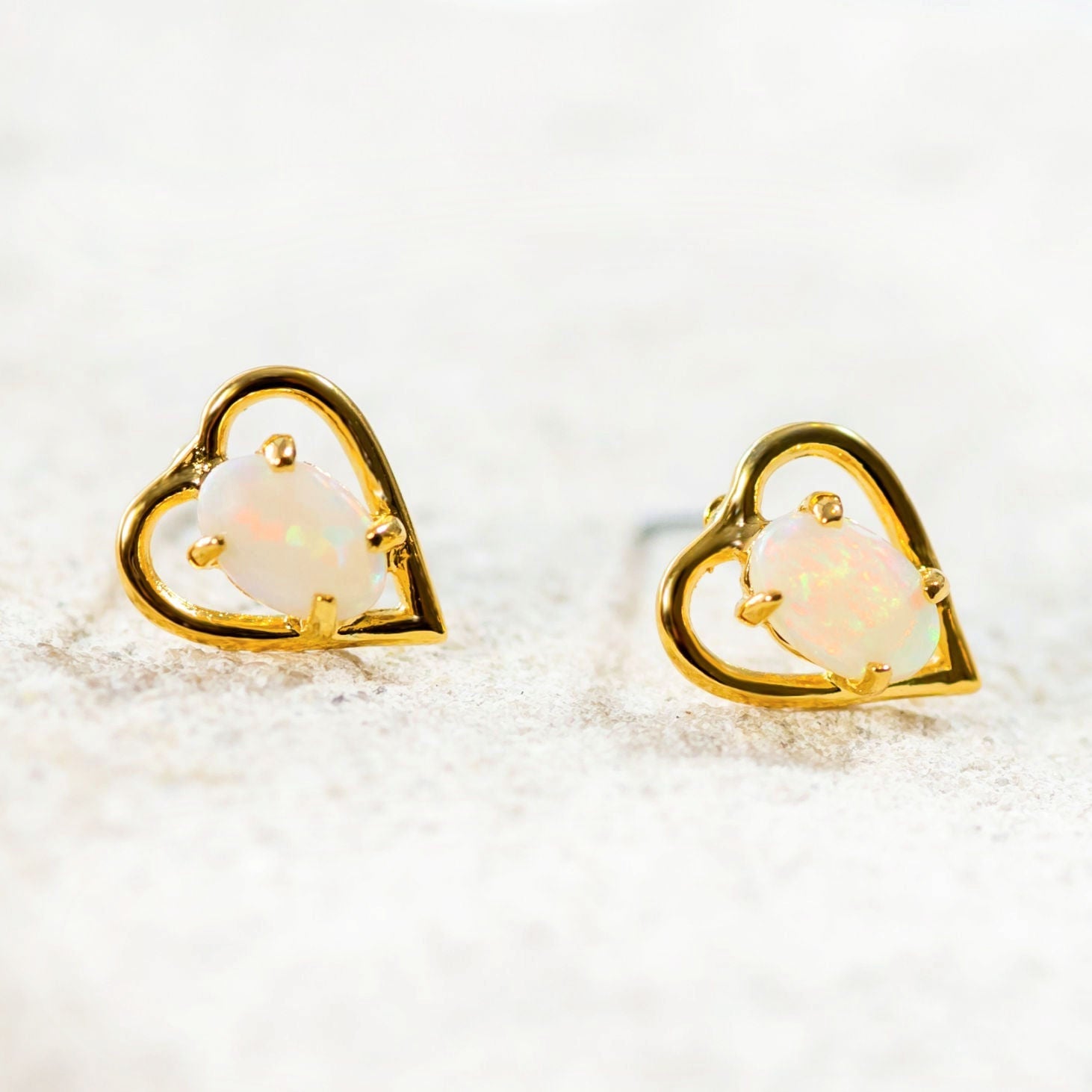 colourful crystal opal earrings with a heart design set on gold plated silver