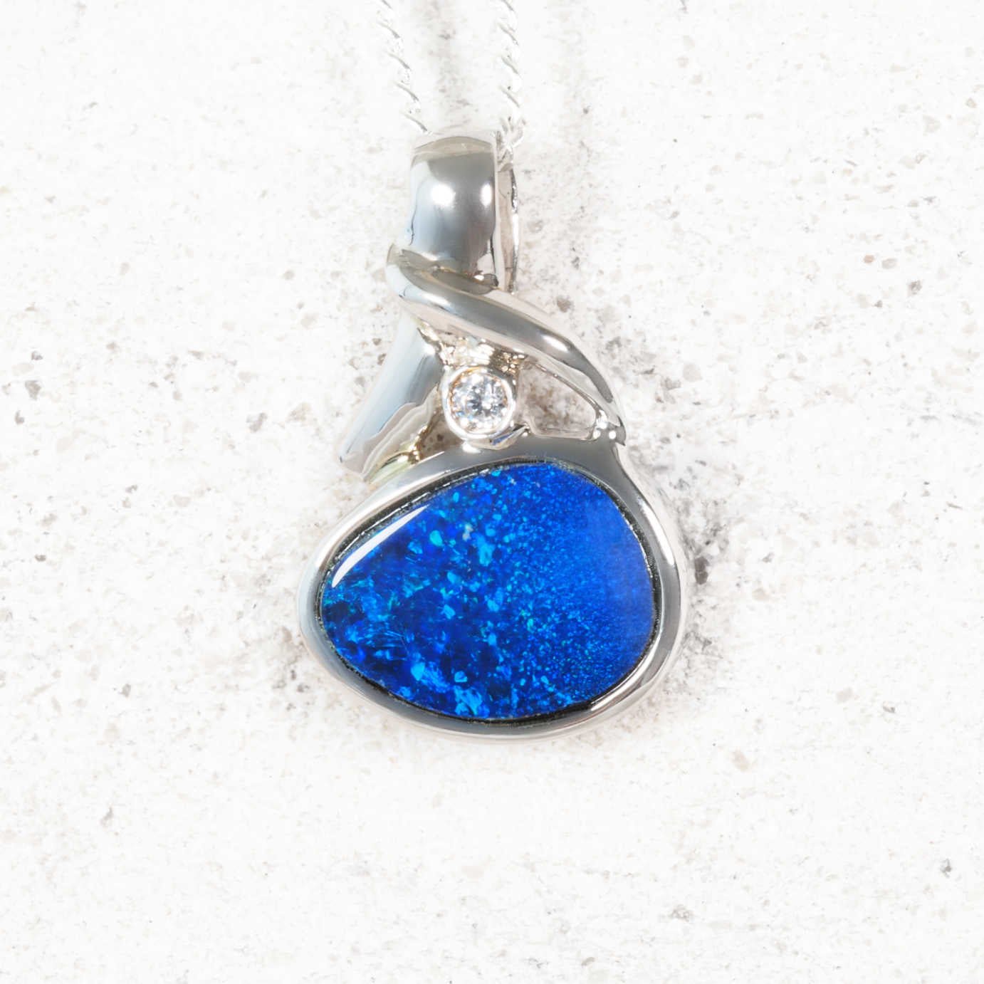 ‘Isola’ sterling silver opal pendant with oval blue Australian doublet opal and crystal accent