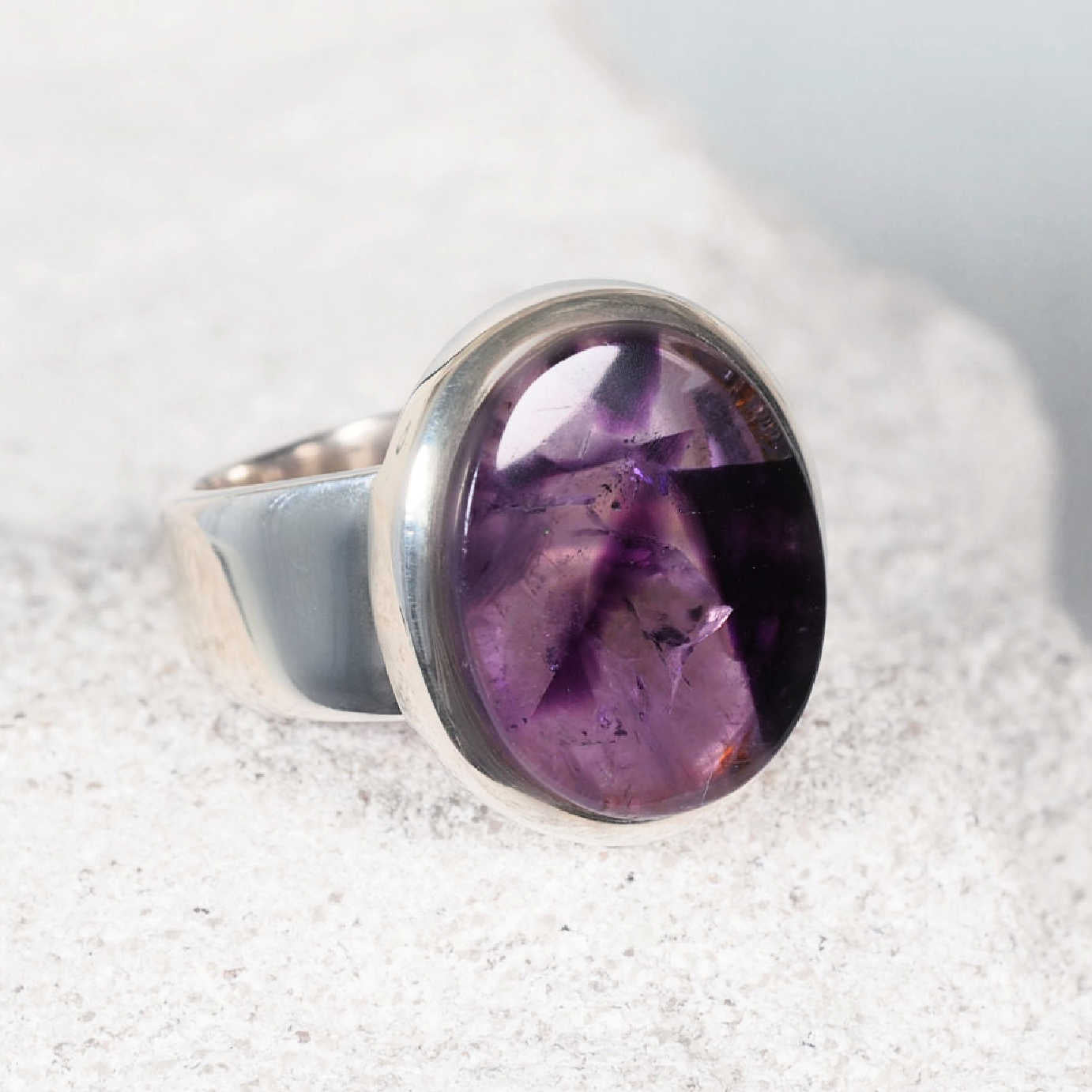 The ‘Jasmine’ amethyst silver ring with a circular cabochon gemstone