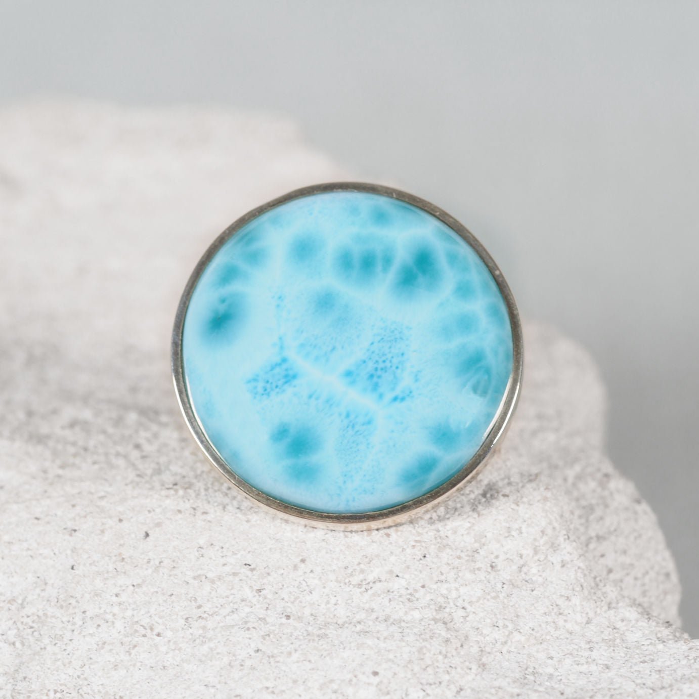 The ‘Julie’ silver ring with a large round Larimar cabochon in sky-blue and white marbled patterns