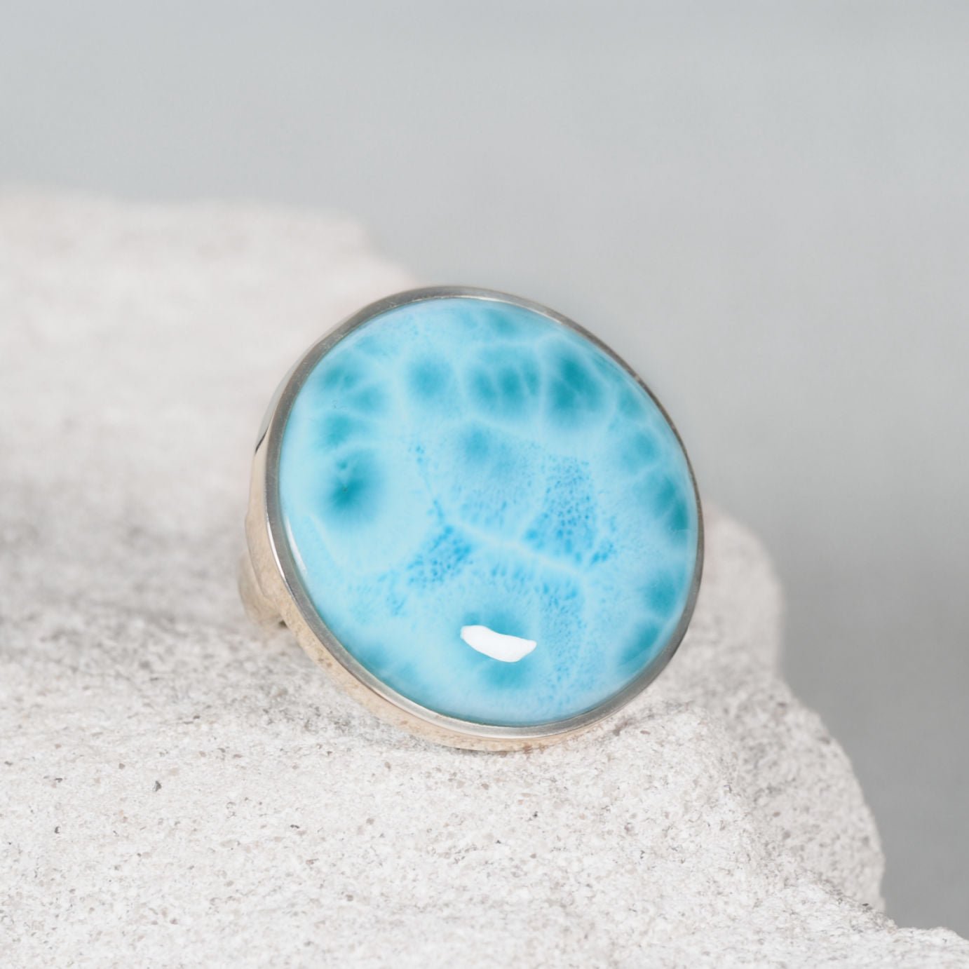 Round Larimar Silver Ring with a bright display of blue hues
