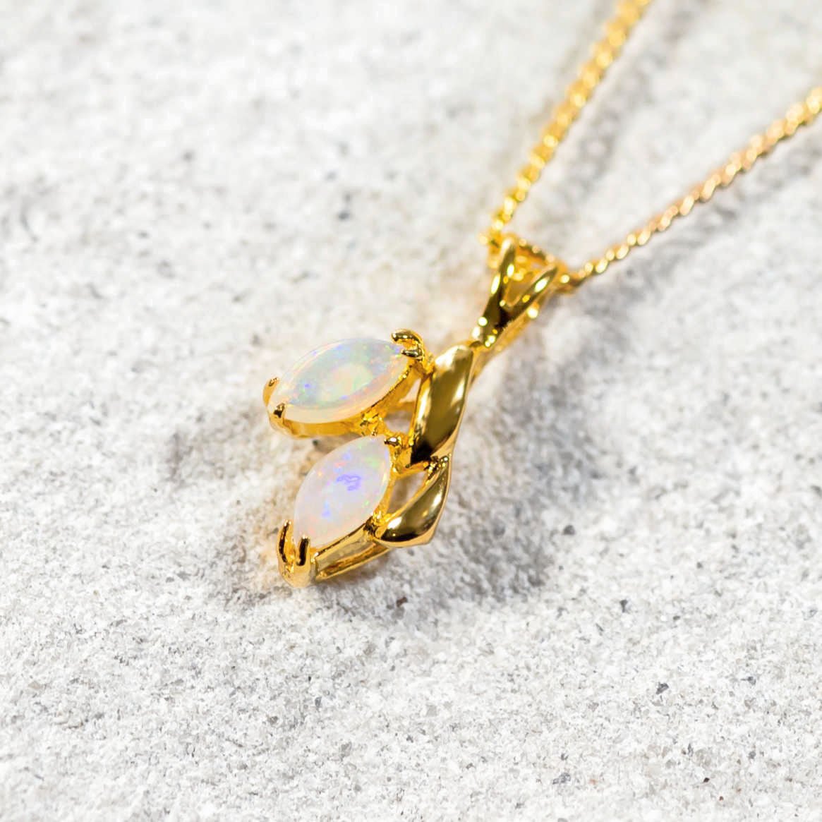 two opal pendant set in gold plated silver