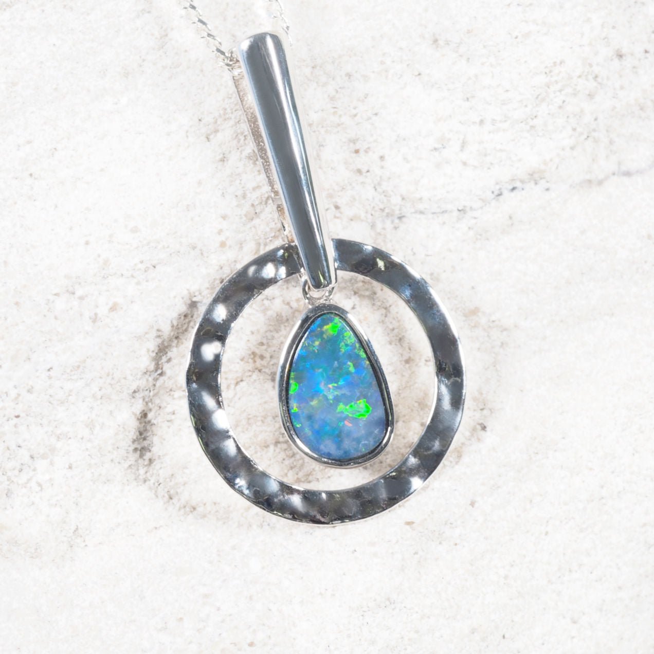 teardrop shape doublet opal pendant set in sterling silver