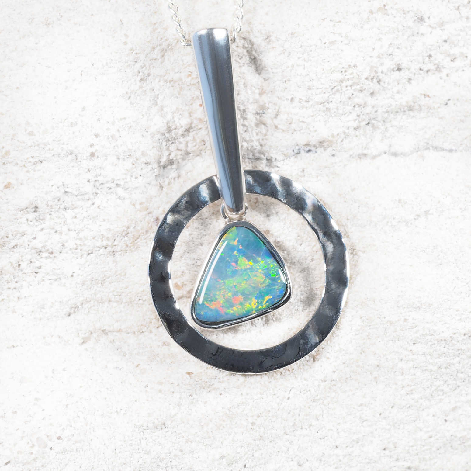 Karis opal necklace with bezel-set Australian doublet opal and hammered sterling silver halo