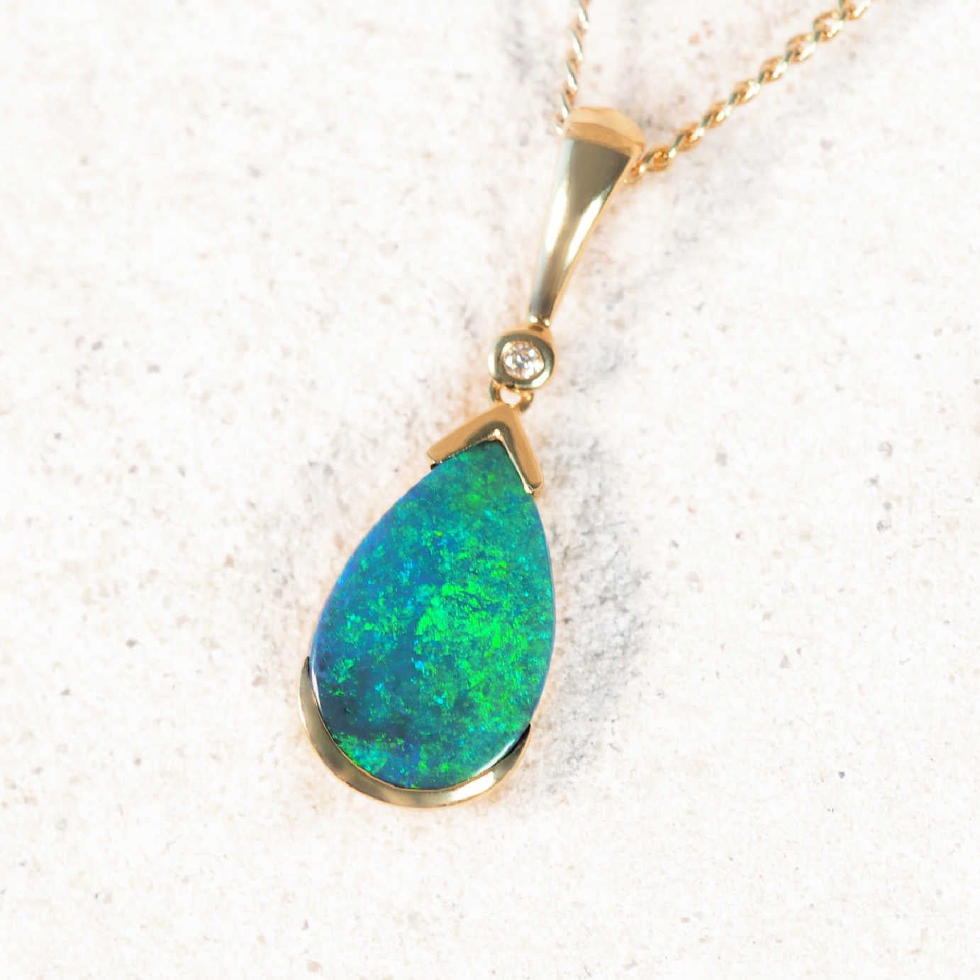 Elegant gold bezel-set black opal pendant by Black Star Opal