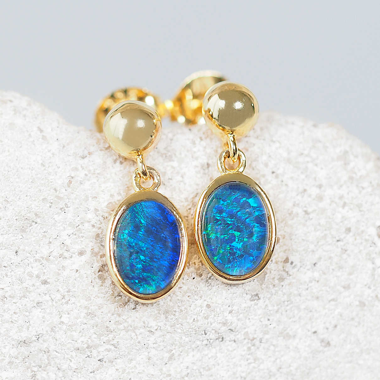 blue opal earrings set in gold plated silver
