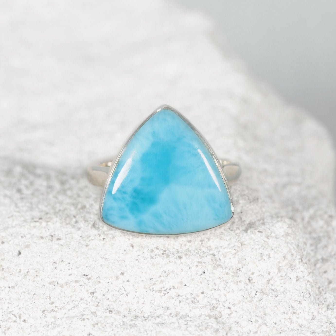 Blue Larimar cabochon ring featuring a sleek triangular design in silver