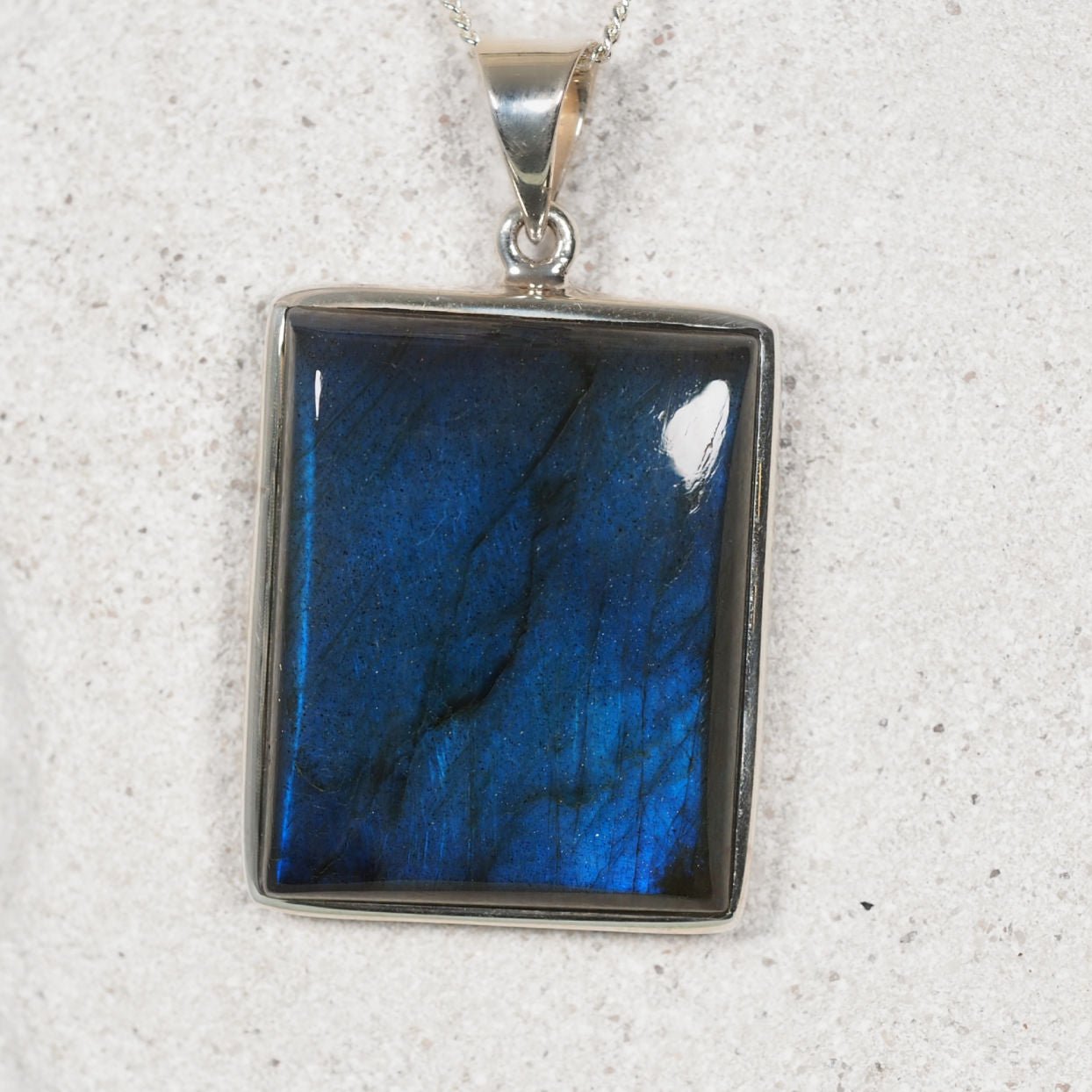 Labradorite Pendant with a silver frame displaying labradorescence