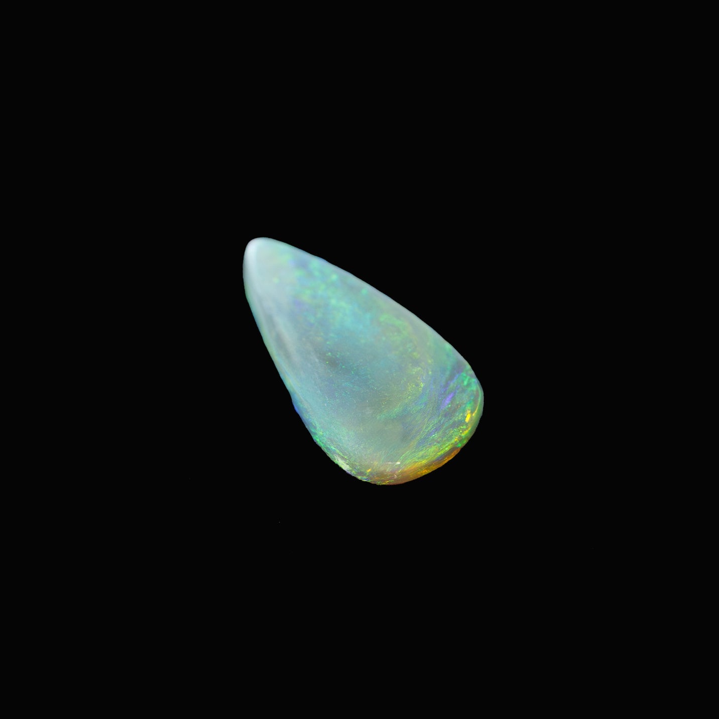 Australian black opal stone on a black background