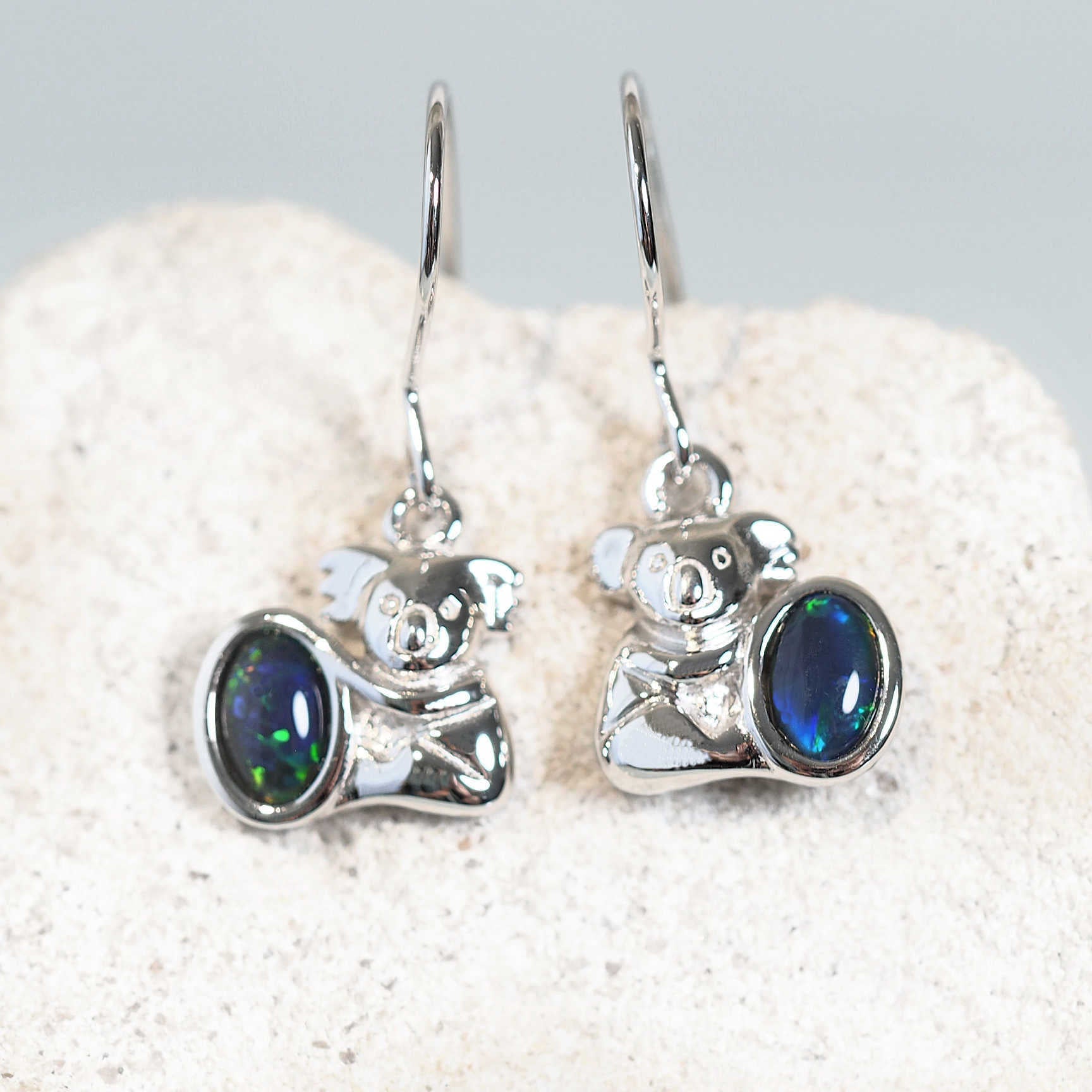 blue and green koala design opal earrings