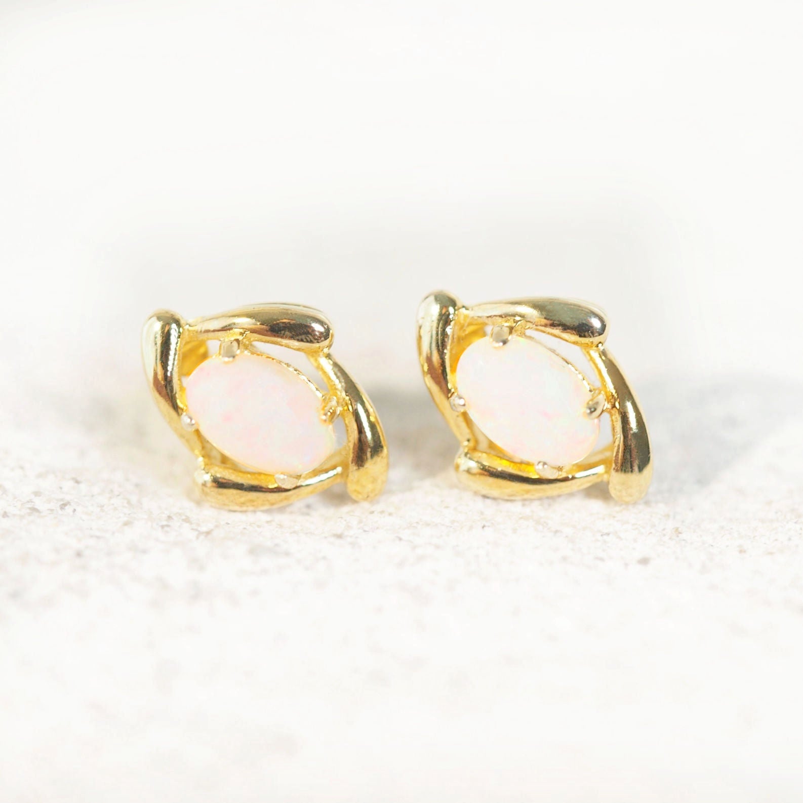 white opal earrings in gold plated silver