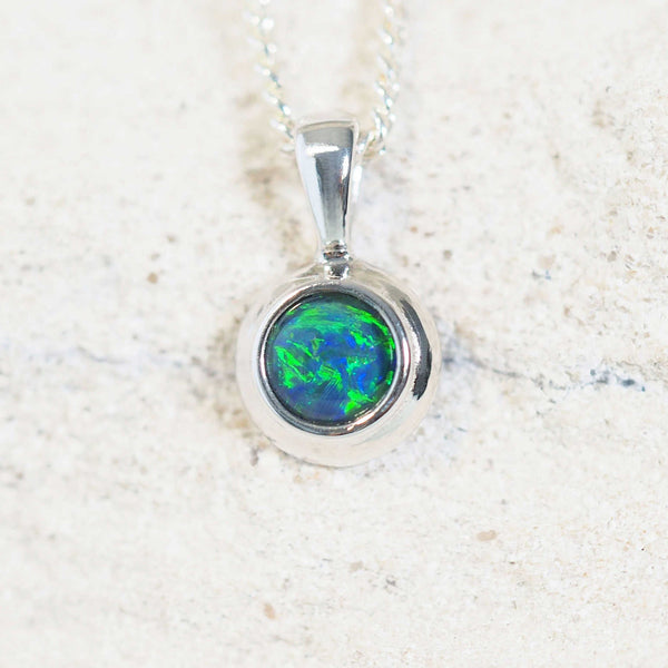 opal necklace set with a blue and green opal in silver