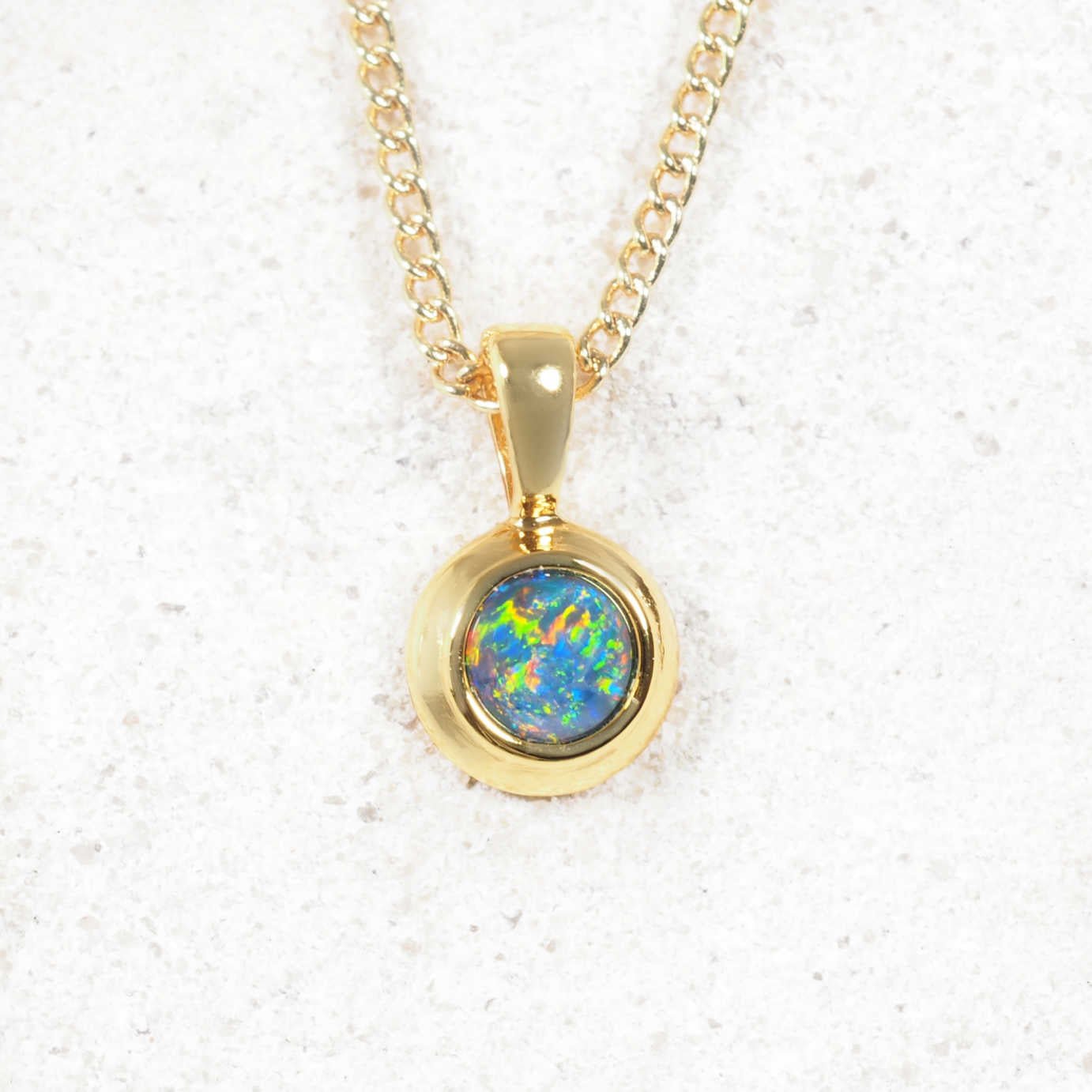 Lana opal pendant in gold-plated silver with bezel-set round Australian triplet opal in multi-coloured tones
